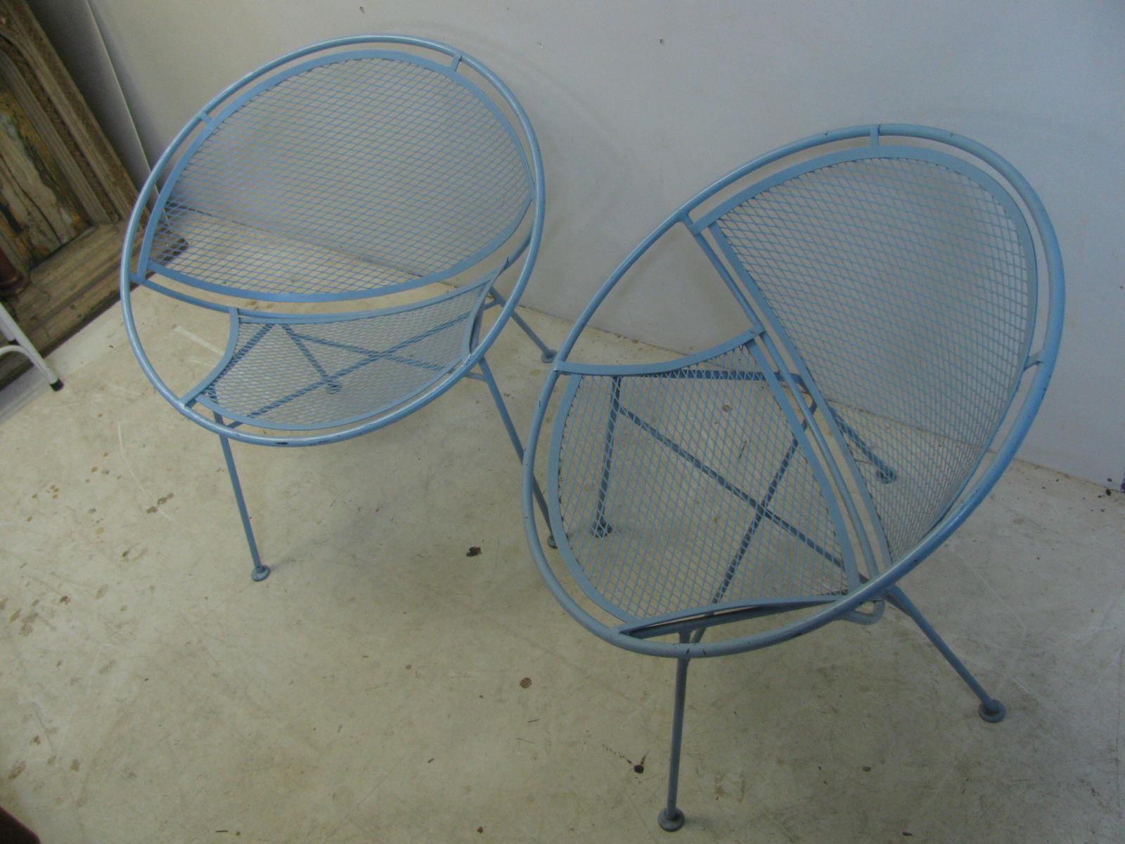 Iconic pair of radar - hoop chairs by Maurizio Tempestini for Salterini. Iron frames have been well maintained as they were kept inside during the winter months so there is no rust and no paint buildup, chairs were restored a few years ago. Color is
