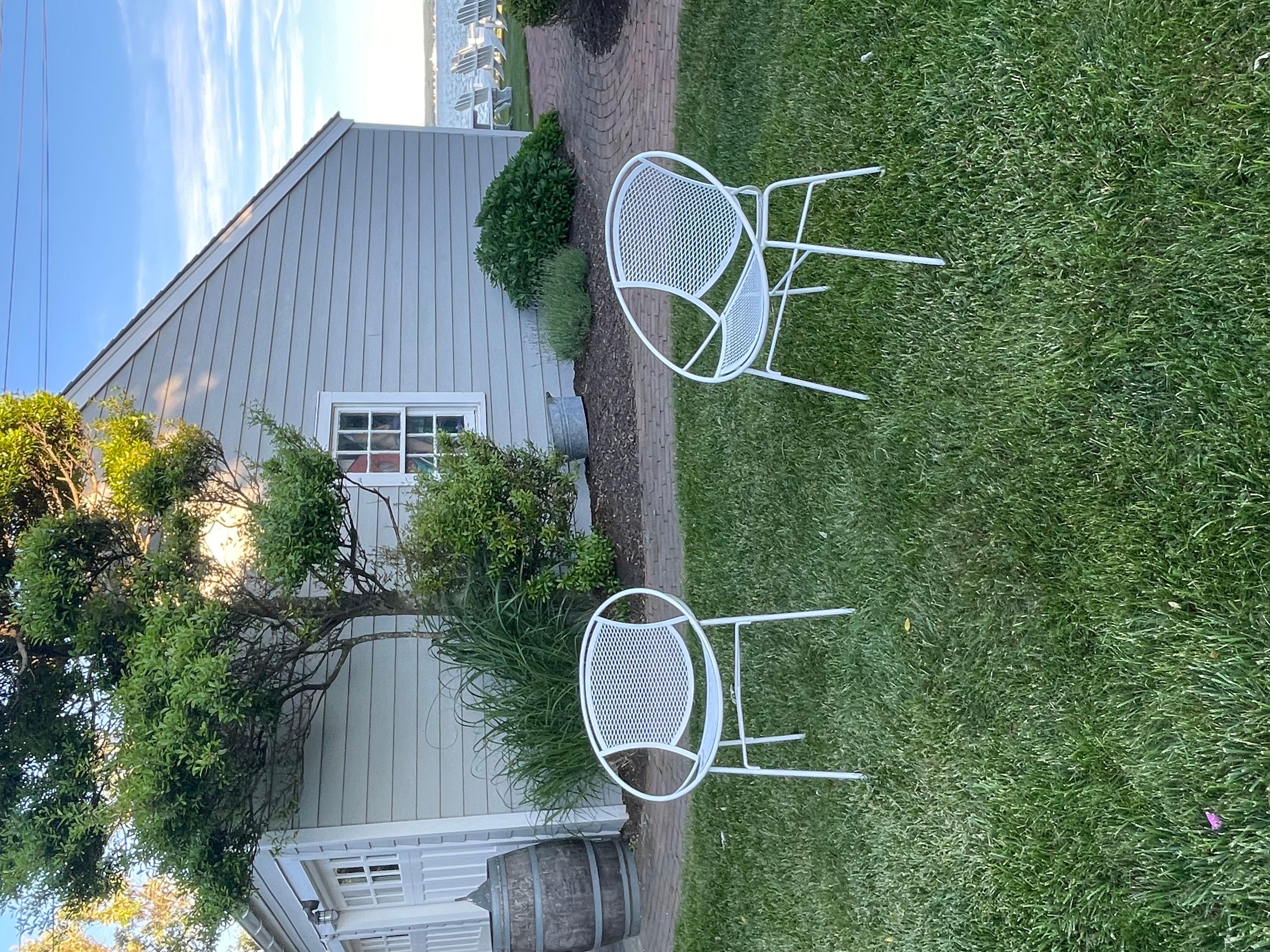 Beautiful pair of Radar Hoop chairs designed by Maurizio Tempestini for Salterini. The pair of chairs are painted white and in very good condition . Very sturdy and no missing parts . These chairs were sometimes called saucer chairs. Very cool and