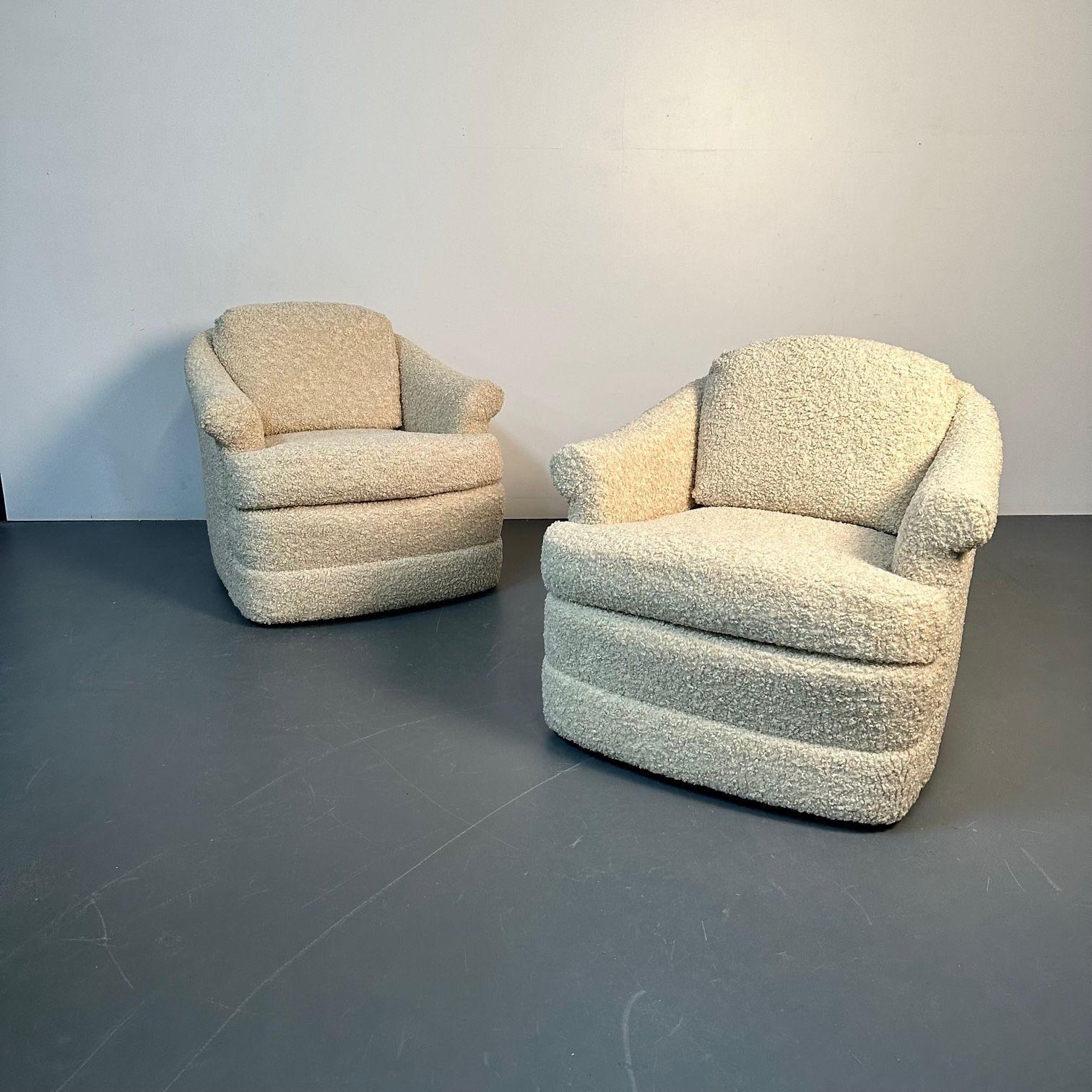 Pair of Mid-Century Modern scroll arm traditional lounge / swivel chairs, bouclé.
Very comfortable pair of beige midcentury swivel or lounge chairs. Newly upholstered in a luxurious tan bouclé/faux fur fabric. Each chair has scroll arms, a swivel