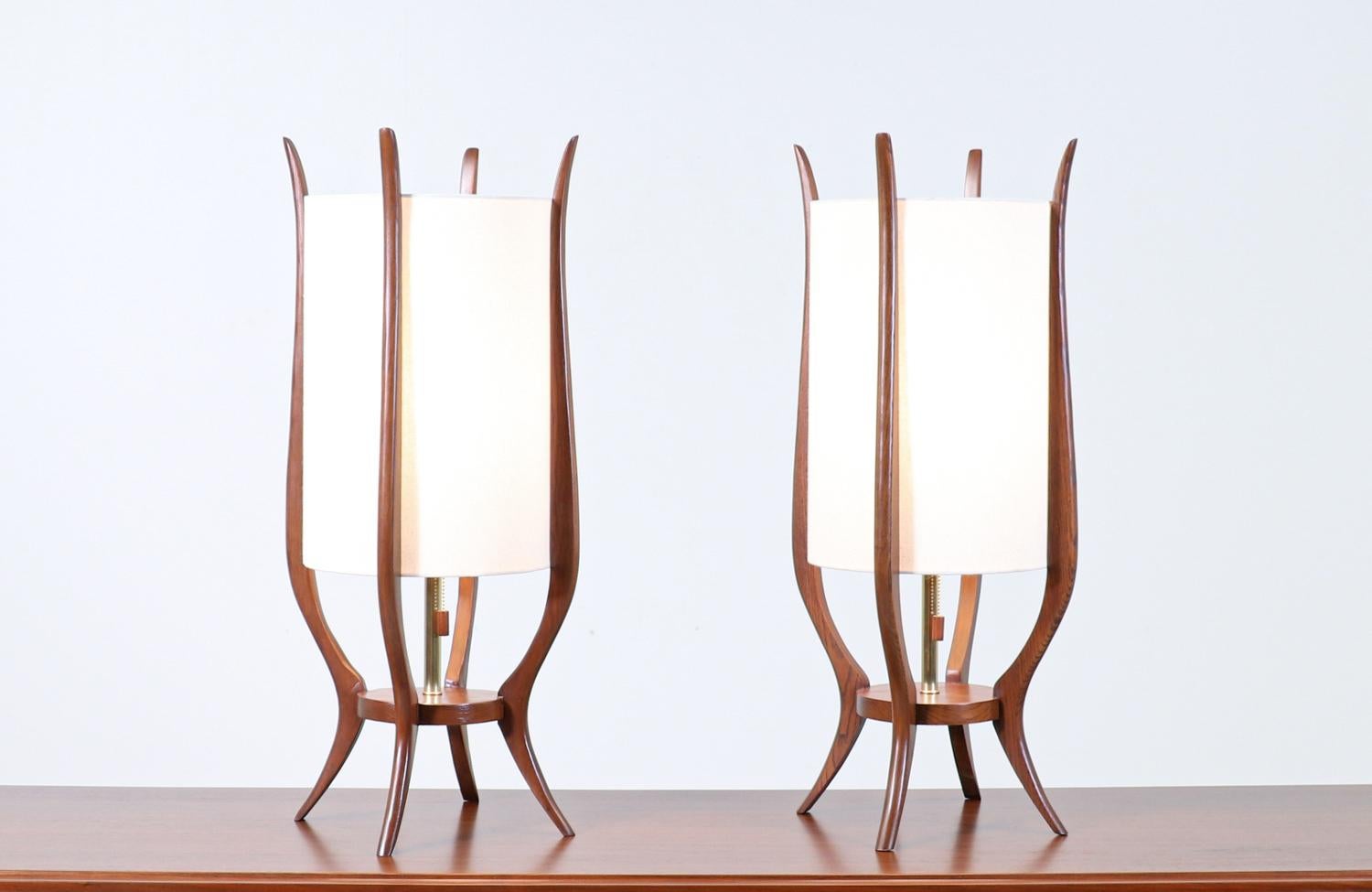 Pair of Mid-Century Modern sculpted walnut table lamps by Modeline.