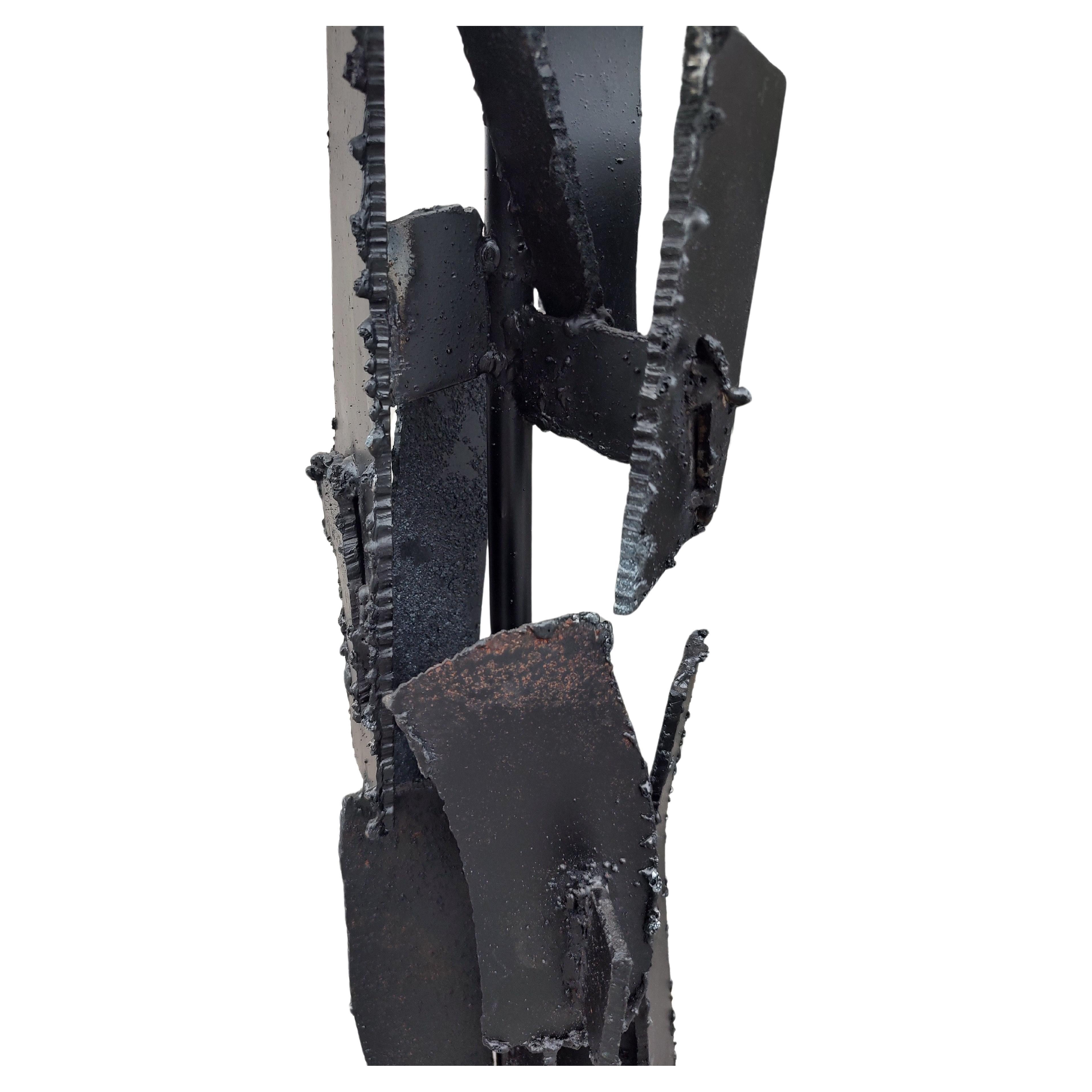 Fabulous and large, 45 inches to the top of the shade. Torch cut and welded steel panels in a random rectilinear form. Sprayed black and in excellent vintage condition with minimal wear. Wiring is sound.