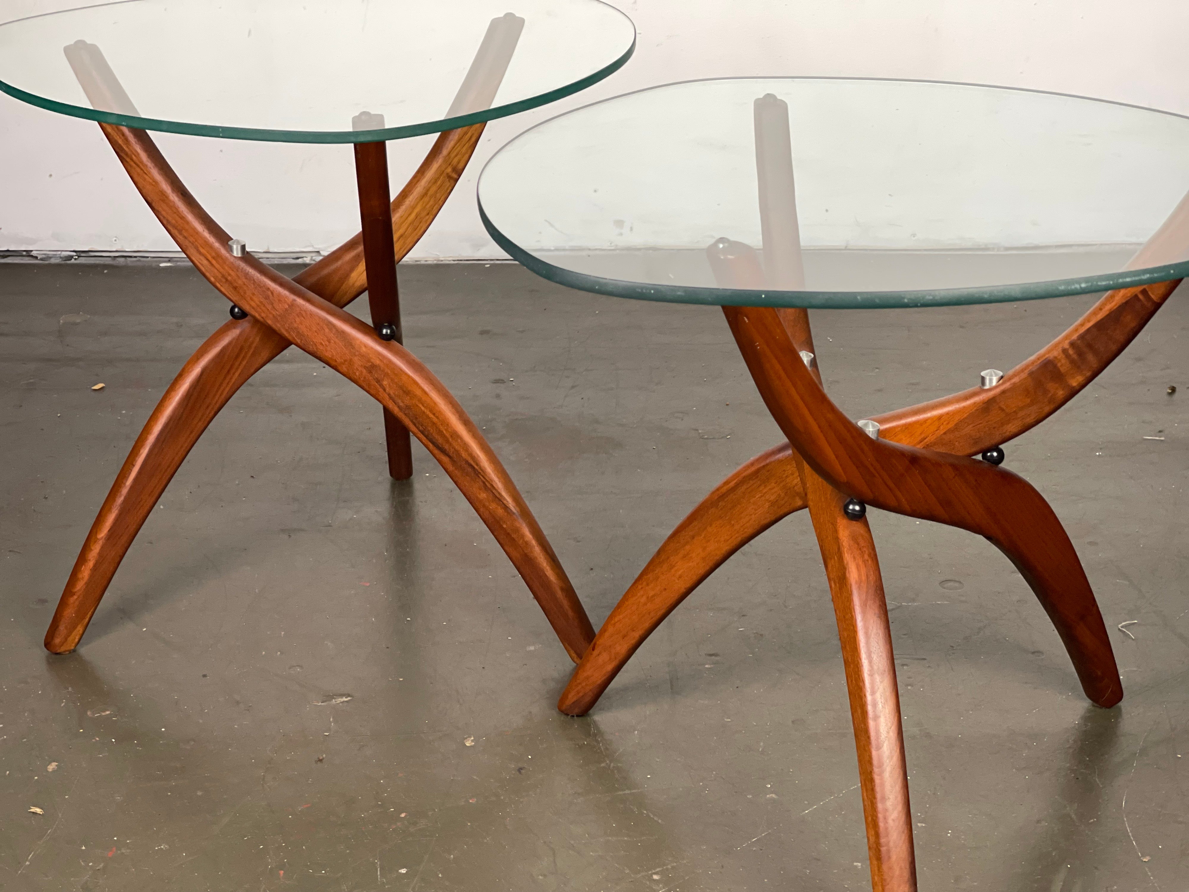 Lovely all-original 1960's Forest Wilson designed minimalist and organic side tables with original rounded triangular glass with pencil polish edges and solid walnut tripod bases very similar to Adrian Pearsall. Minor wear. Minor abrasions. Two very