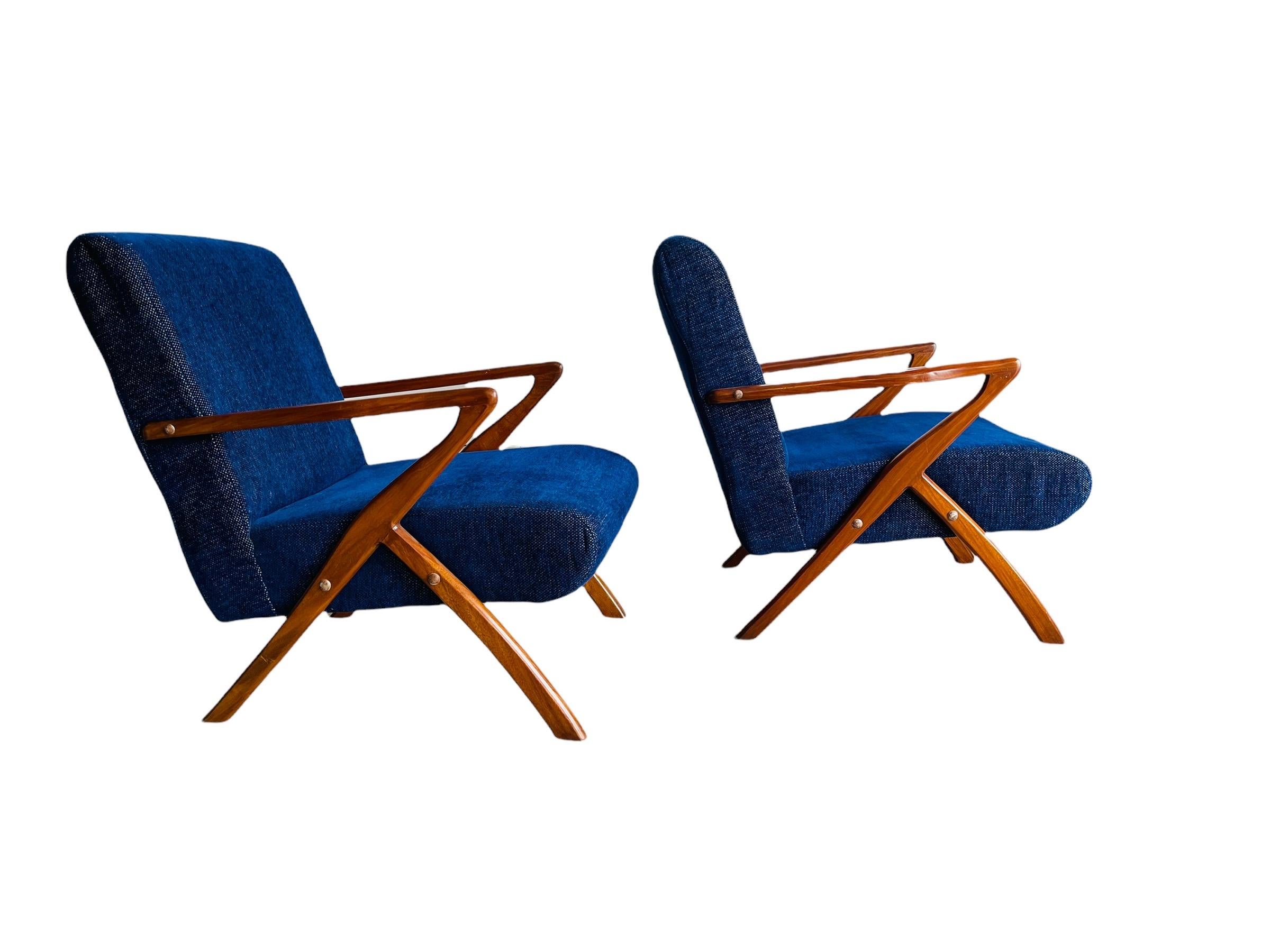 Here is a stunning Pair of Mid-Century Modern Selig Style Z chair with walnut frame. The chairs have a beautiful walnut frame with dark-blue/ midnight blue fabric. The chairs are very stylish and comfy. The chair are in good vintage condition with