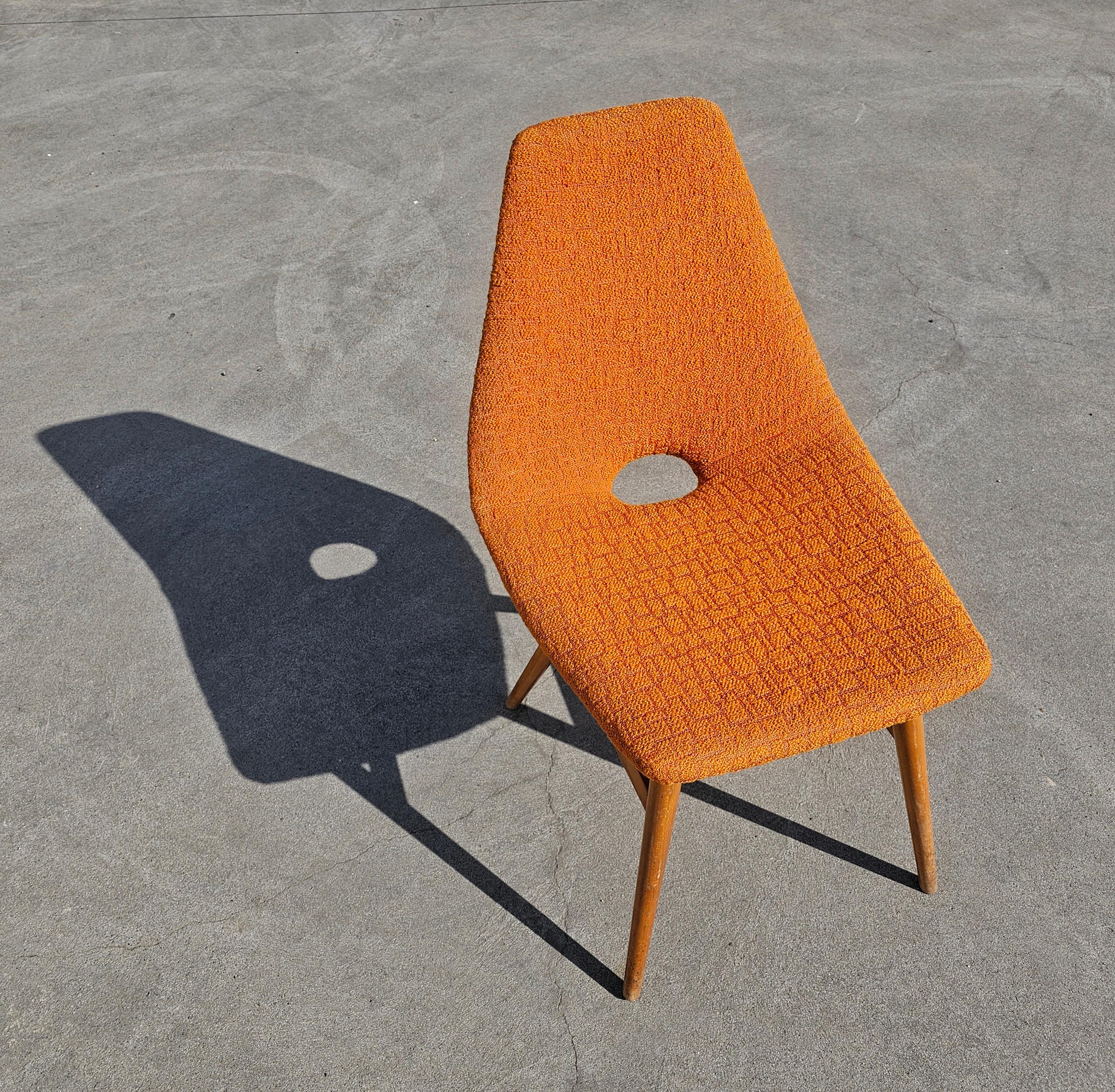In this listing you will find a Pair of Rare and extremely attractive Mid Century Modern Chairs designed by Judit Burian and Erika Szek in vibrant orange fabric with beautiful texture, which is the original fabric the chairs we upholstered with when