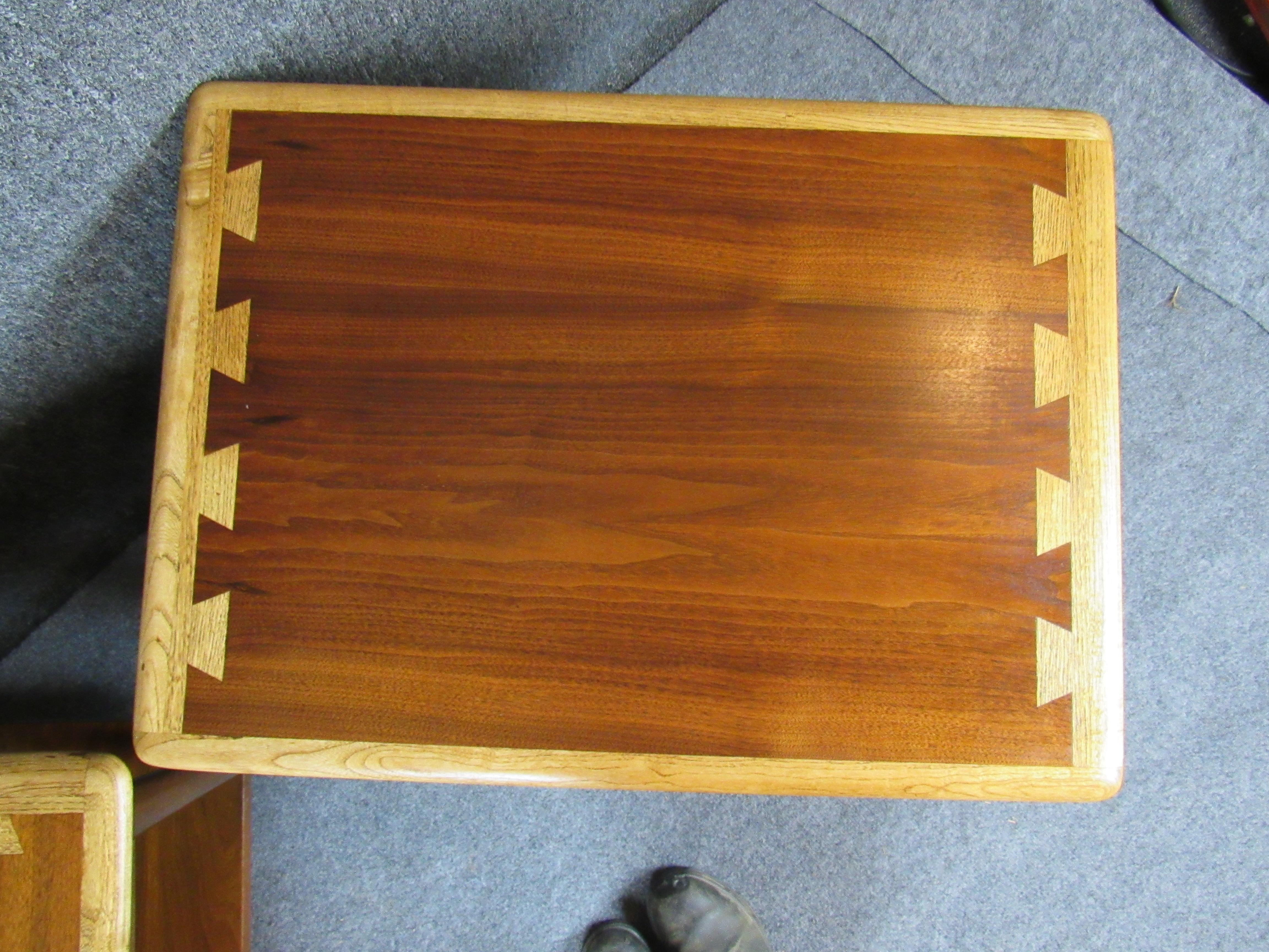 A pair of vintage walnut side tables by Lane, these show off a rich wood grain with dovetailed sides to the table's top. 
Please confirm item location with seller (NY/NJ).