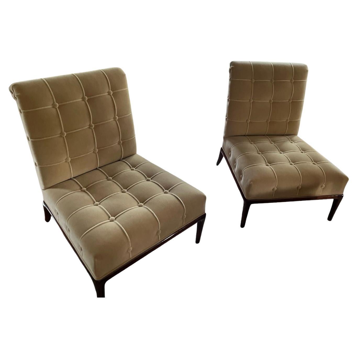 Pair of mid century chairs attributed to T.H. Robsjohn-Gibbings. Impeccably restored in a rich walnut finished, complemented by tailored and tufted luxuriously soft, light earthtone tan mohair upholstery. Timeless and elegant design that will be the
