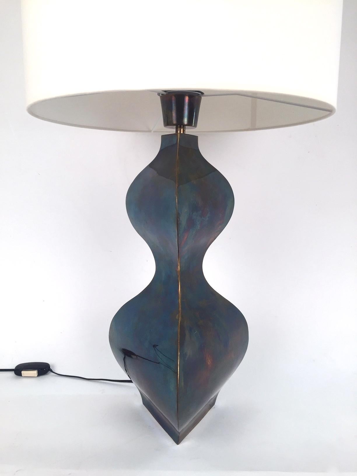  A single Spanish table lamp edited by Artespaña in the 1970s. Patinated metal and handmade shade. Base height 48 cm. Shade height 30cm.