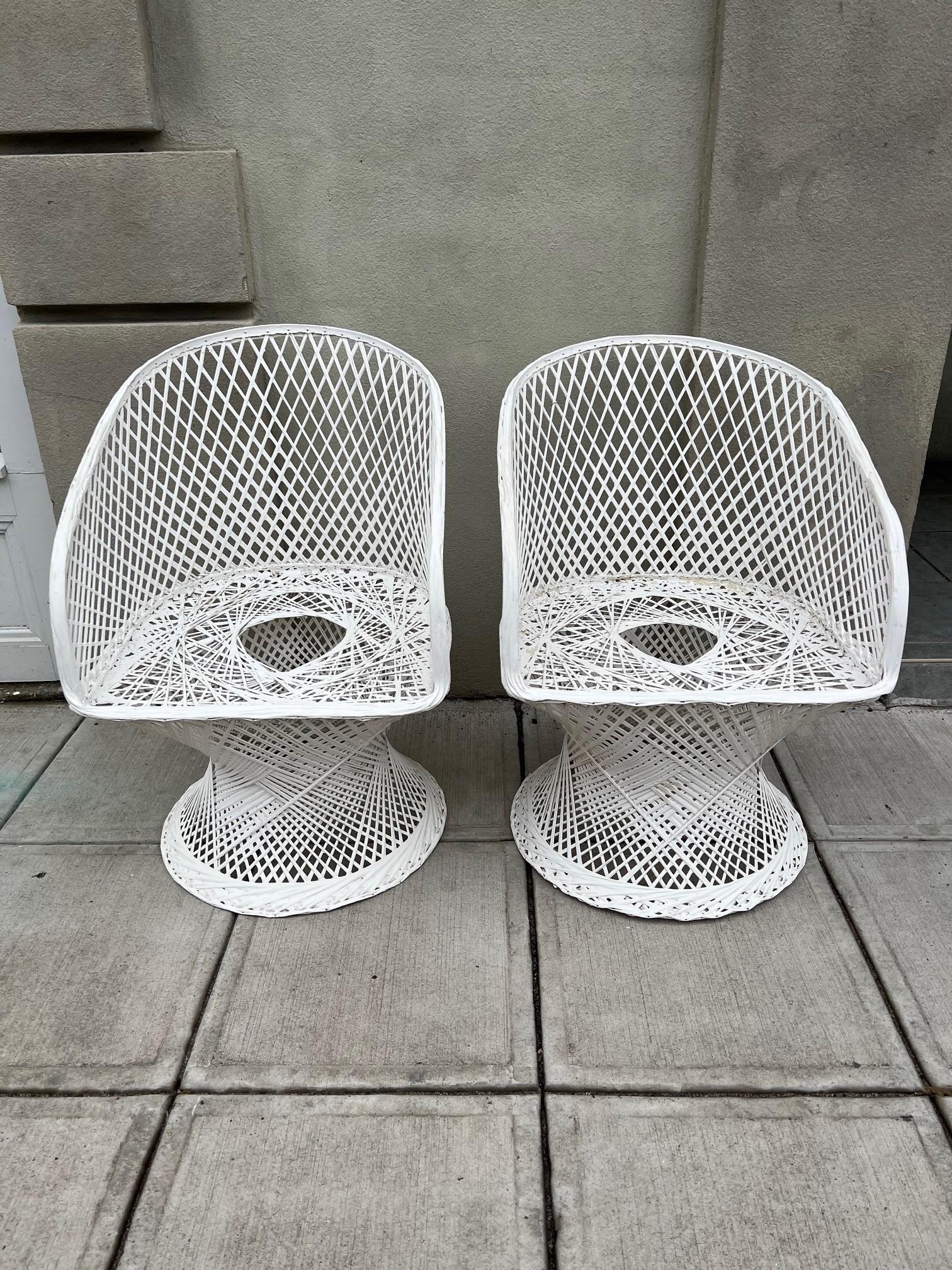 Mid Century Modern pair of chairs by Russel Woodard. Made from a strong durable spun fiberglass which can be used either in or outdoors. The two chairs came from a Greenwich Ct. estate and are in great condition only missing the cushions. This spun