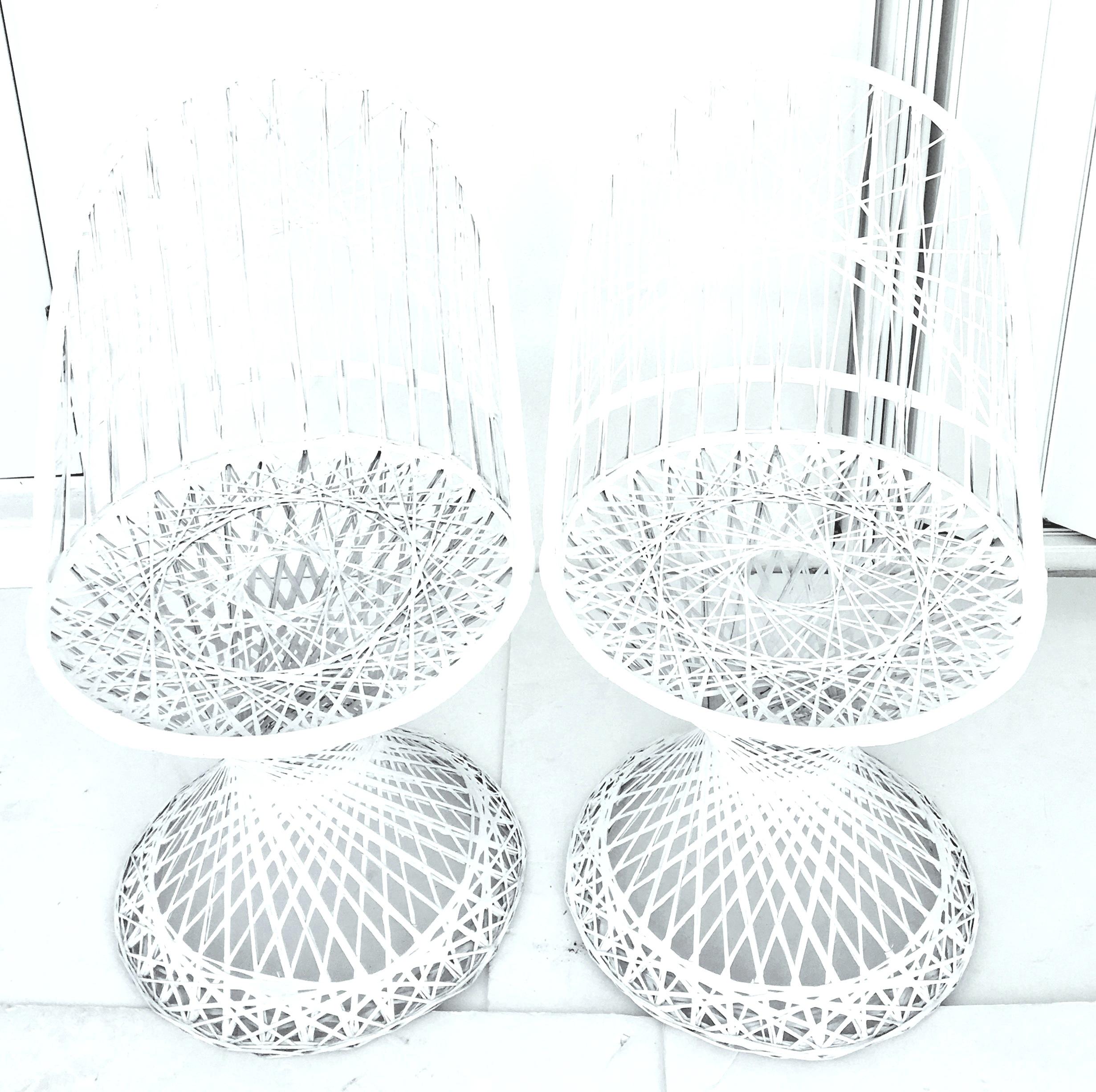 Mid-Century Modern spun fiberglass lattice slipper chairs by Russell Woodard. Newly painted in the original white. These chairs are light weight and can be used in or outdoors.
 