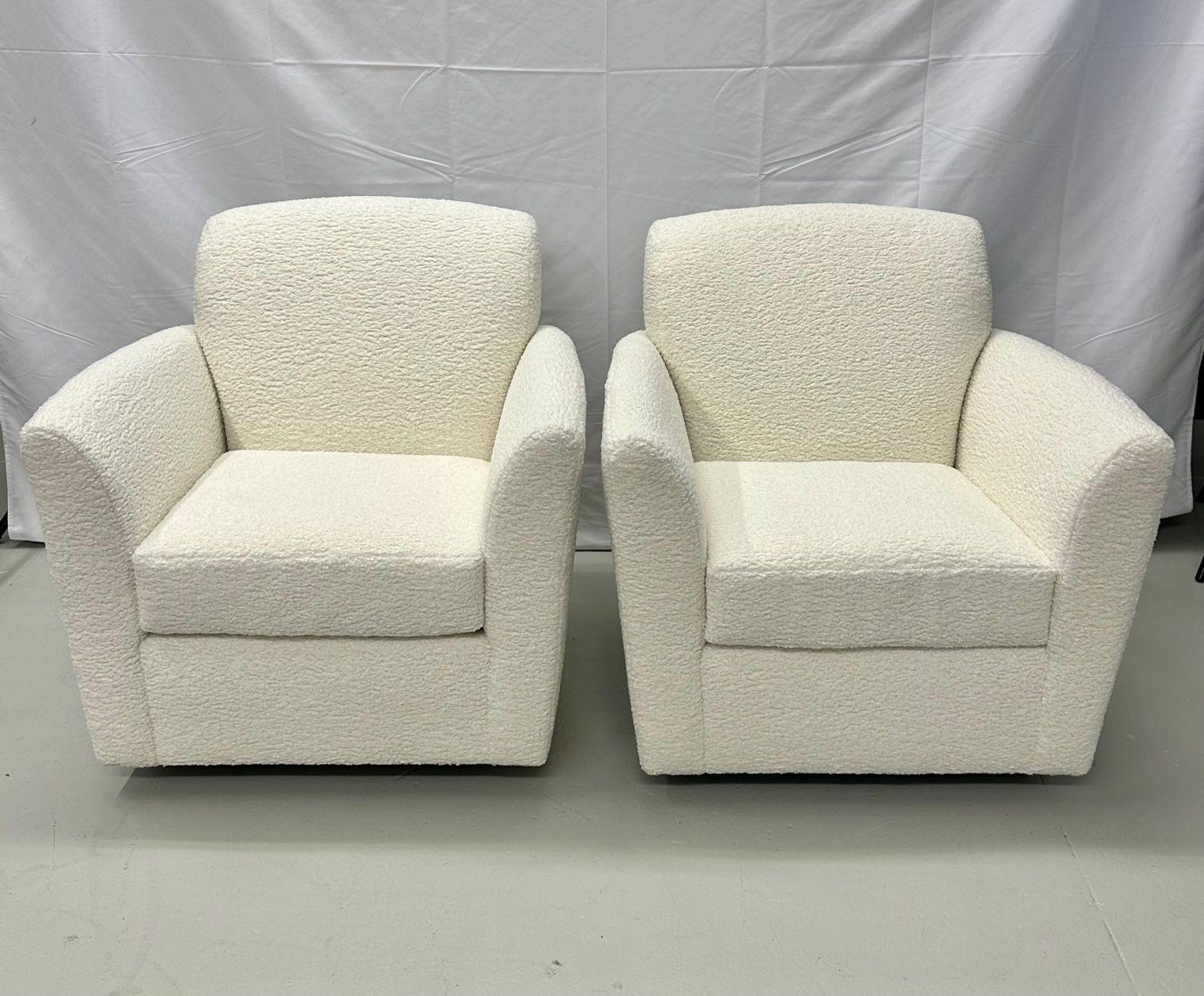 Pair of Mid-Century Modern square white boucle rocking lounge / swivel chairs

Square form chic mid-century swivel chairs newly upholstered in a luxurious, thick white boucle fabric. New cushioning. These chairs are very comfortable and have a