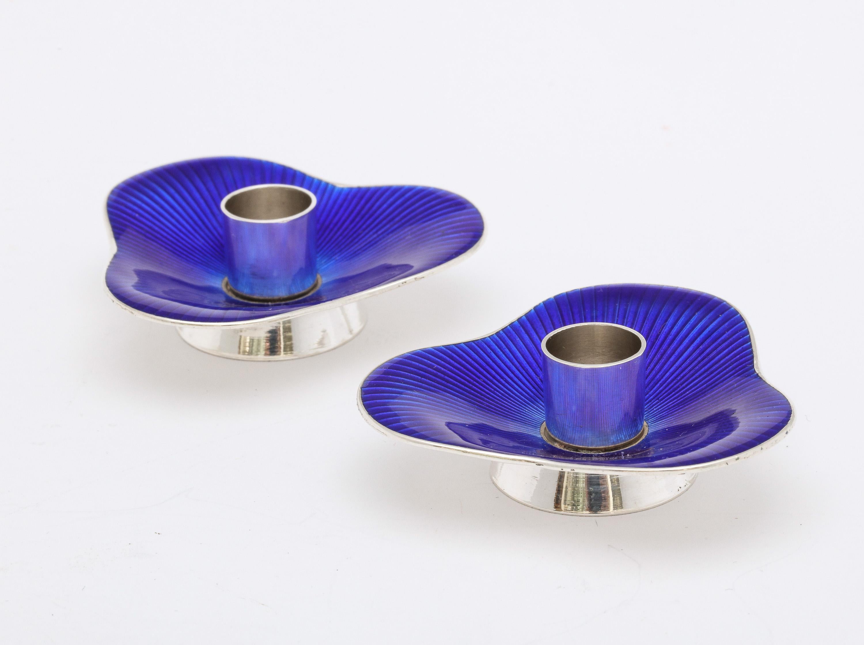 Pair of Mid-Century Modern, sterling silver and deep cobalt blue enamel candlesticks, each having a pedestal base, Denmark, Ca. 1950's-60's, Meka - maker. Each candlestick measures 2 1/4 inches wide (at widest point) x 2 1/4 inches deep (at deepest