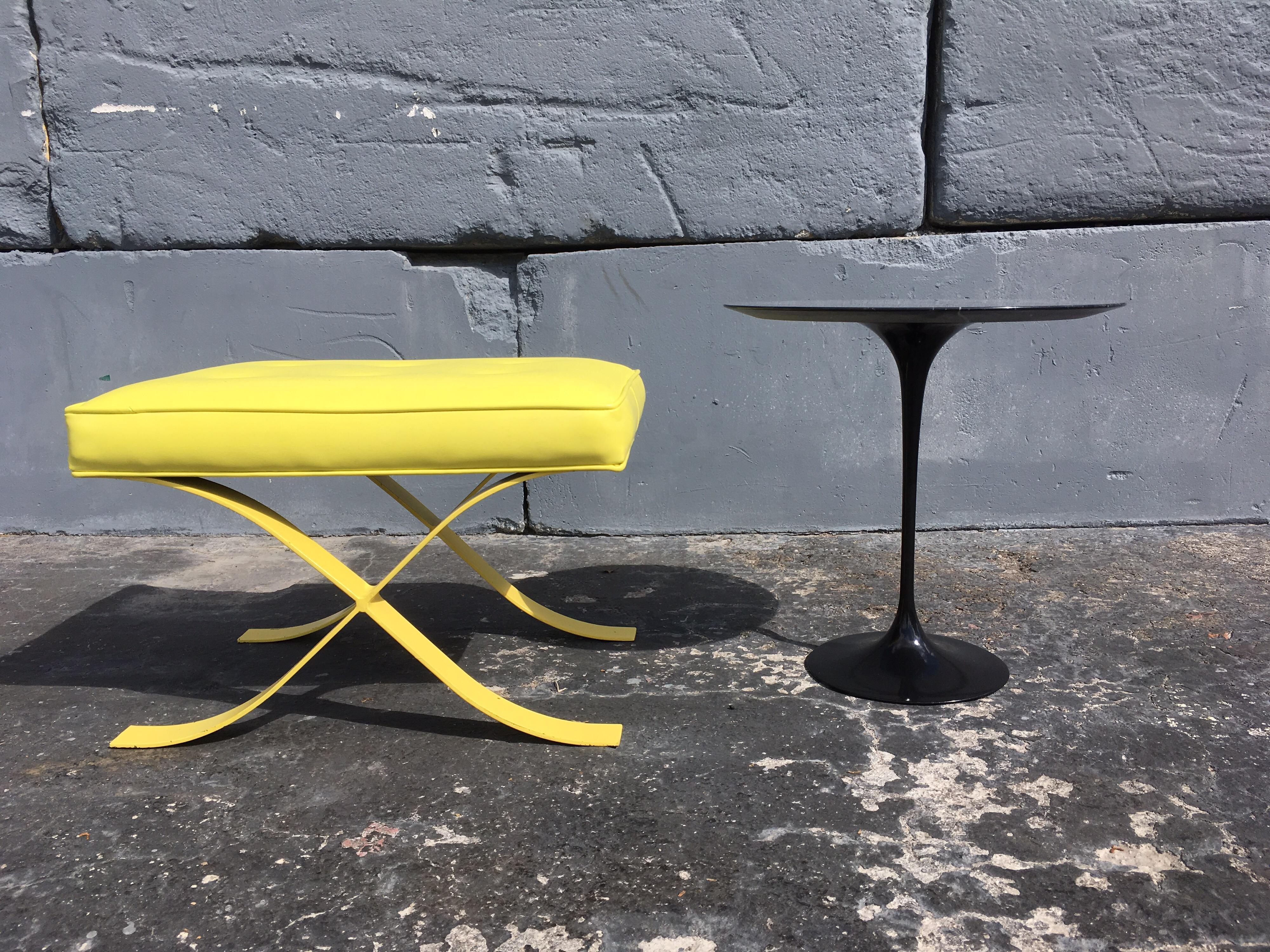 All original 1960s stools with yellow vinyl and yellow painted steel bases.