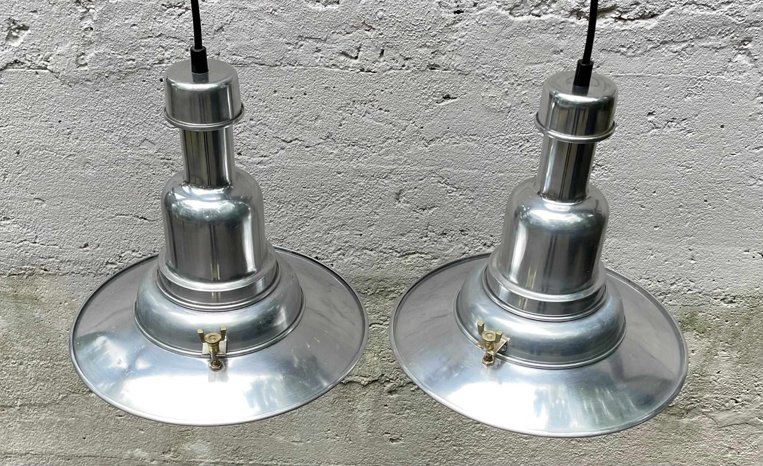 Amazing pair of Mid-Century Modern aluminum pendant lights, super high quality and authentic. Beautiful detailing with brass accent attachments.