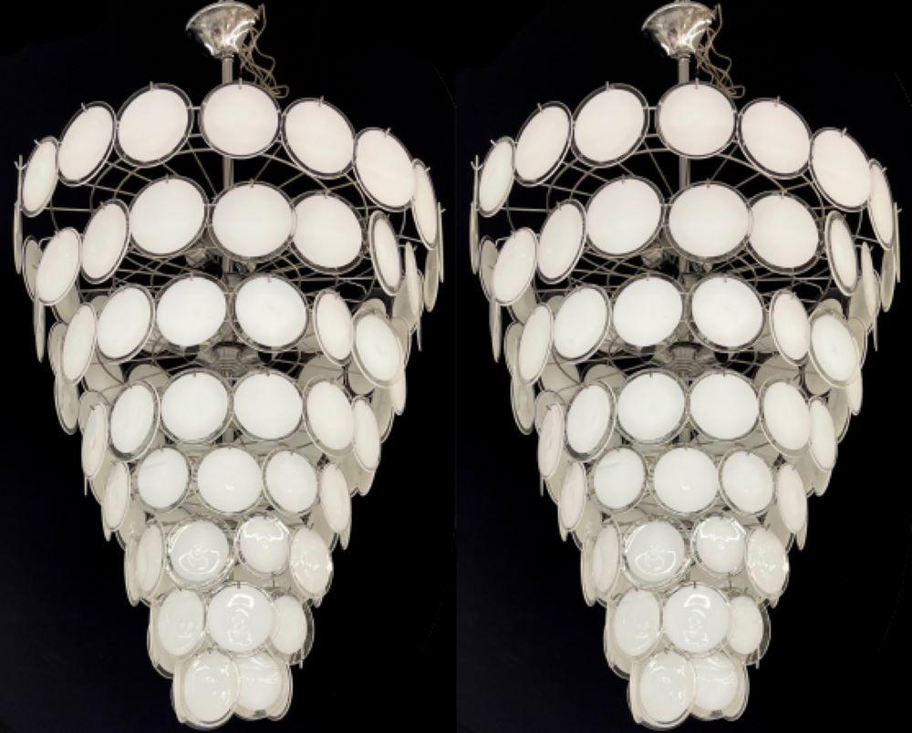An impressive palatial pair of Mid-Century Modern circular disc white alternating color chandelier. These are large chandeliers having 104 pieces circular Murano glass spheres approximately six inches in diameter. When set up on a dimmer the color