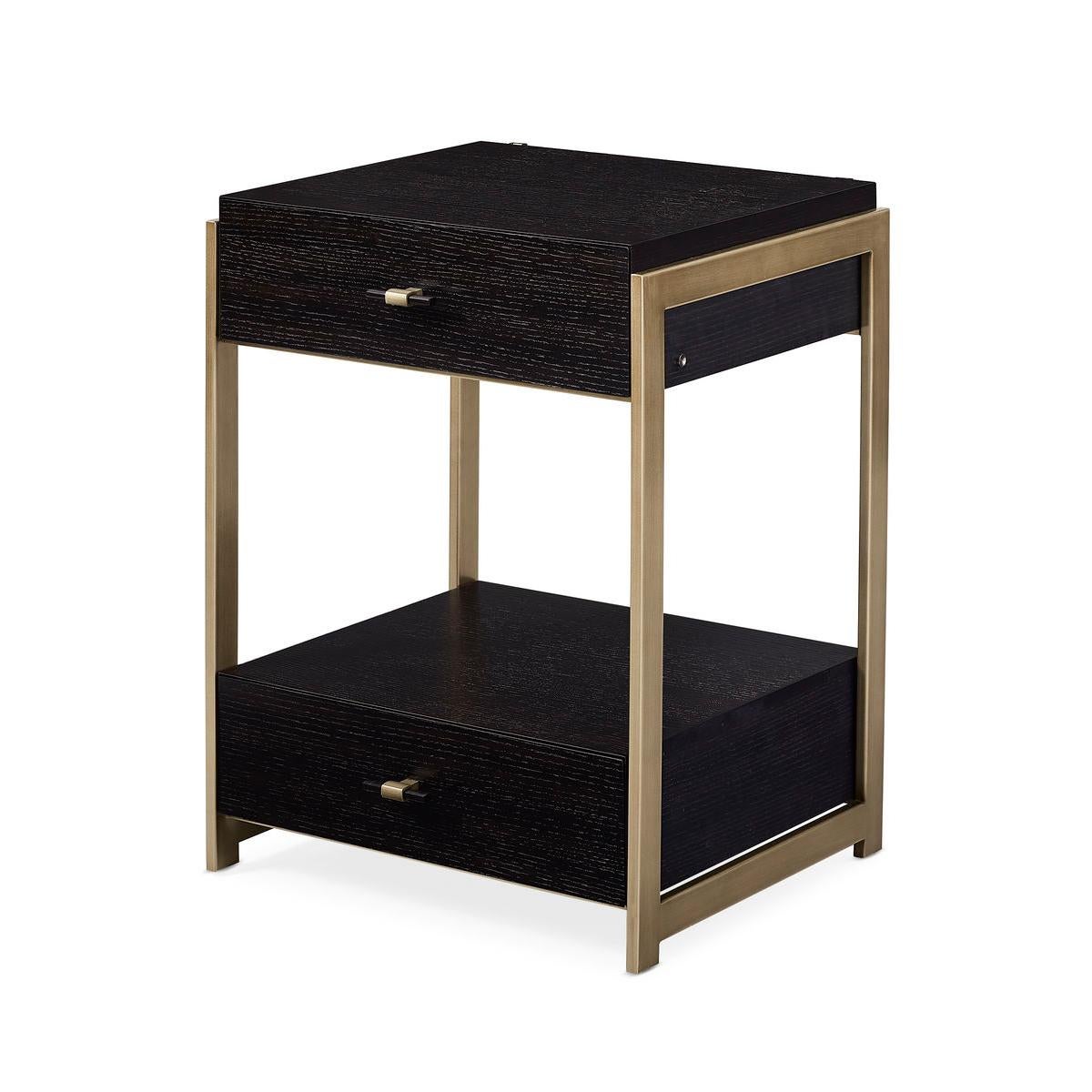 Its geometric profile feels architectural and is accentuated by a rich black stained Ash finish. Bronze highlights its metal frame and angular legs while adding a hint of warmth. With two drawers and an open storage area, this nightstand offers