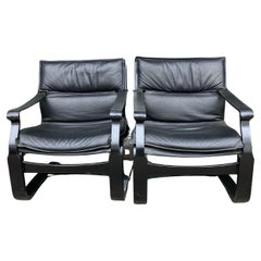 Pair of Mid Century Modern Swedish Black Leather Ake Fribytter Lounge Chairs