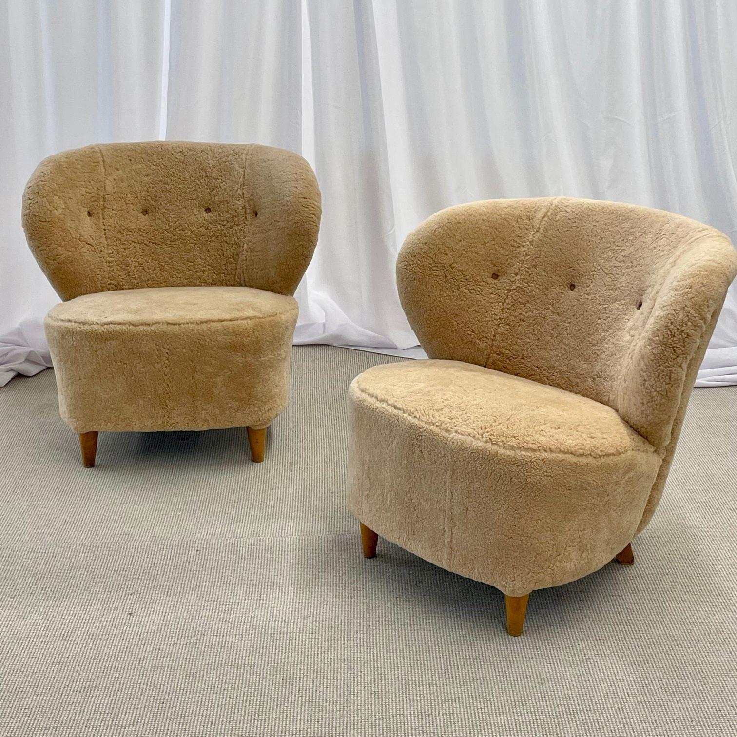 Pair of Mid-Century Modern Swedish lounge/slipper chairs, Sven Staaf, 1950s
 
Gorgeous pair of shearling Swedish modern lounge or slipper chairs. Newly upholstered in a chic honey sheepskin with new cushioning. Each chair sits on four lacquered