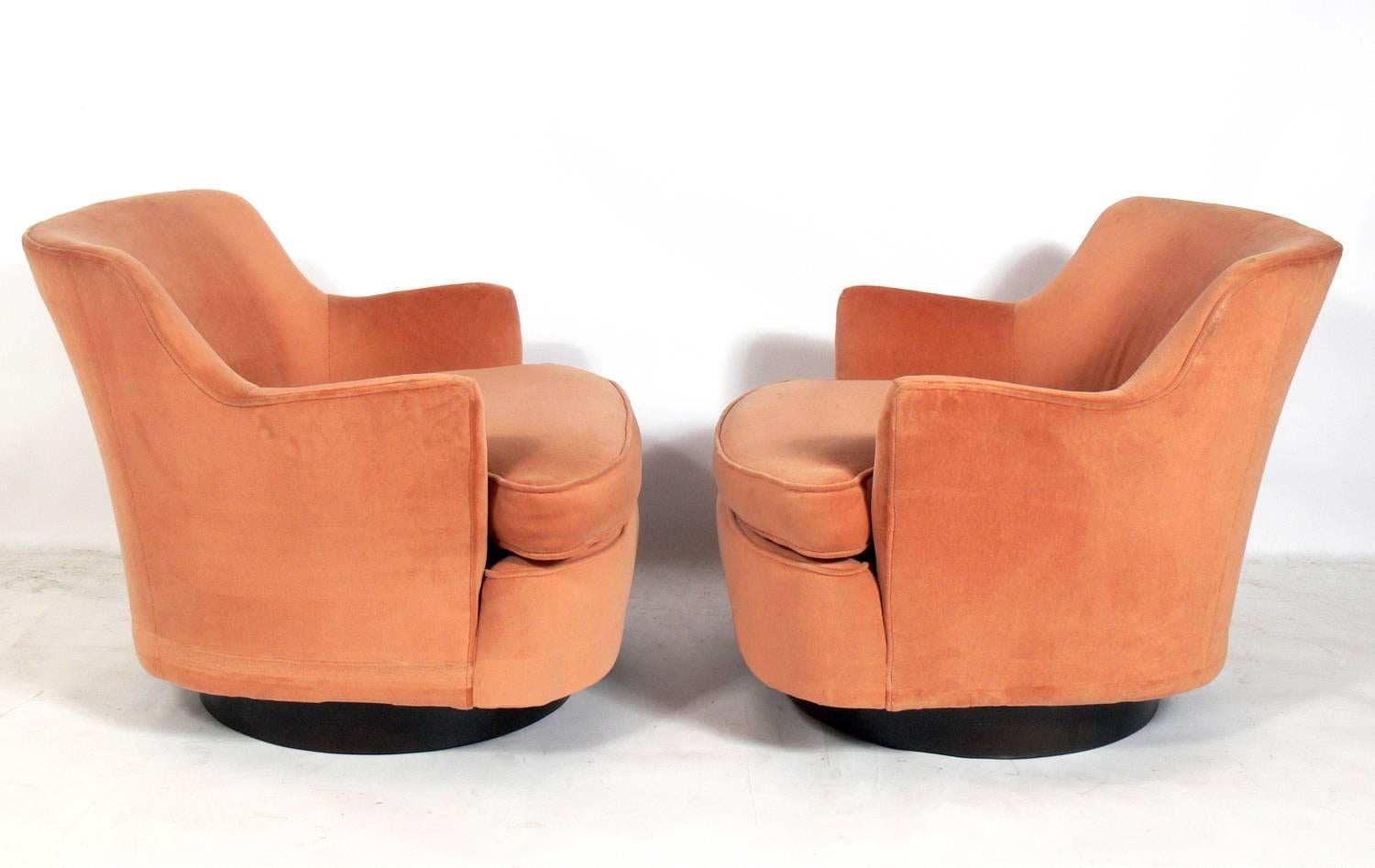 Pair of Mid-Century Modern swivel lounge chairs, attributed to Adrian Pearsall, unsigned, American, circa 1960s. These pieces are currently being reupholstered, and can be reupholstered in your fabric. The price noted below includes reupholstery in