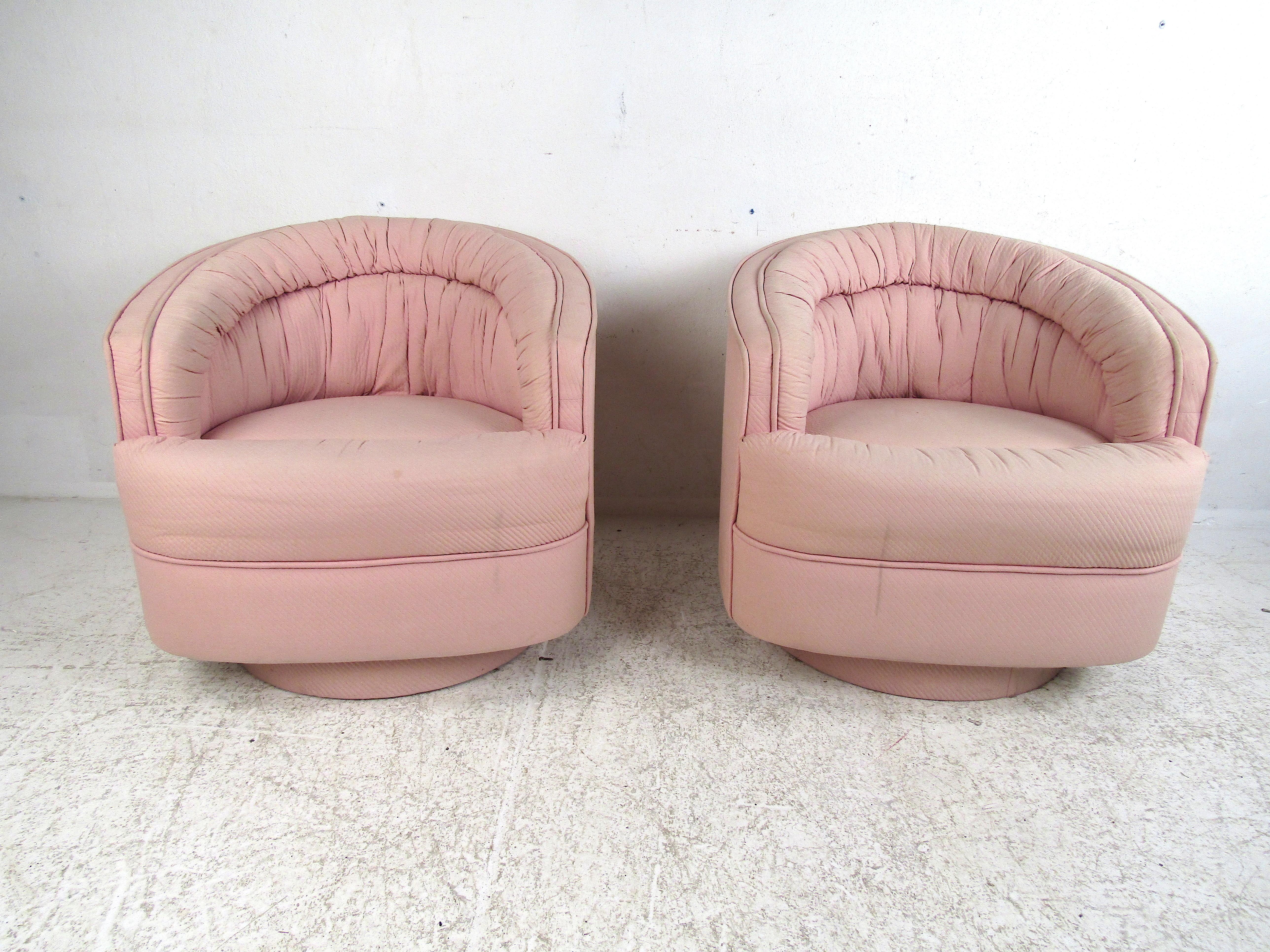 Nice pair of midcentury swiveling club chairs. Comfortable padded seats and rests, smooth swiveling action. This pair is sure to complement any modern interior. Please confirm item location with dealer (NJ or NY).