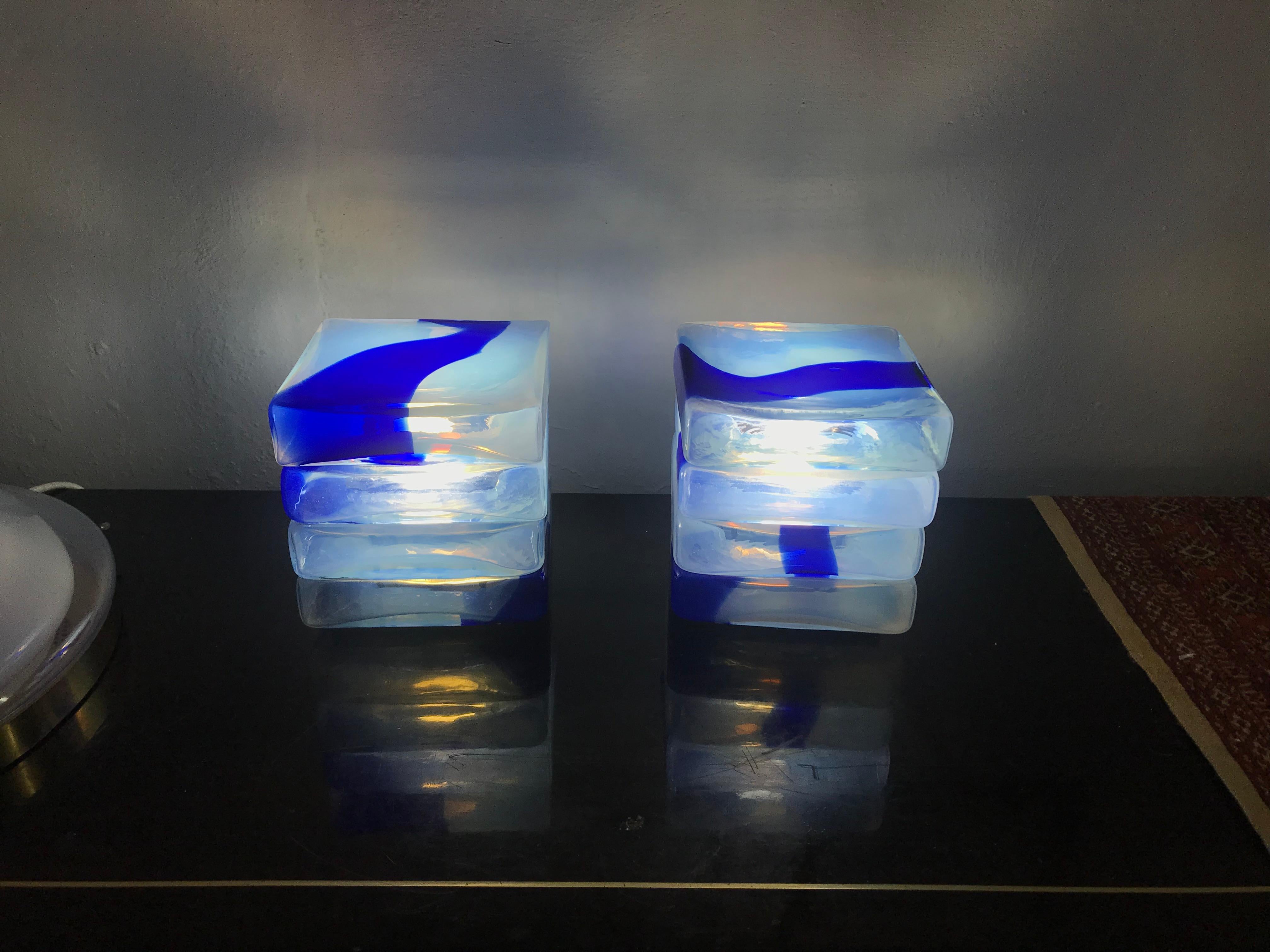 Pair of Space age one-light table lamps by Carlo Nason for Mazzega, circa 1970.
Each lamp consist of four stacked pieces of opalescent and blue Murano glass.
This lamp is the smallest version of this model.