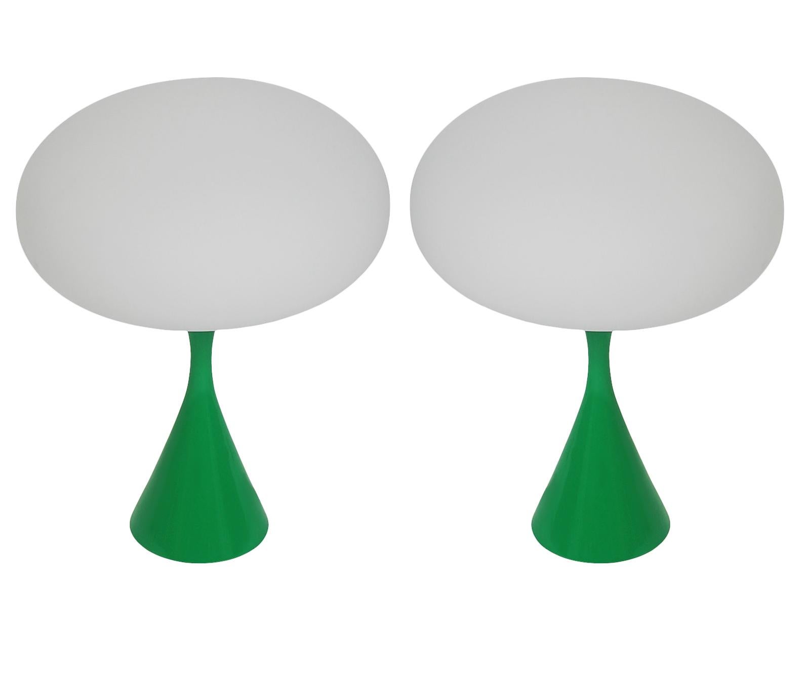A handsome matching pair of table lamps in a conical mushroom form after Laurel Lamp Company. The lamp features a cast aluminum base with a green powder coat and a mouth blown frosted glass lamp shade. Price includes the pair as shown.