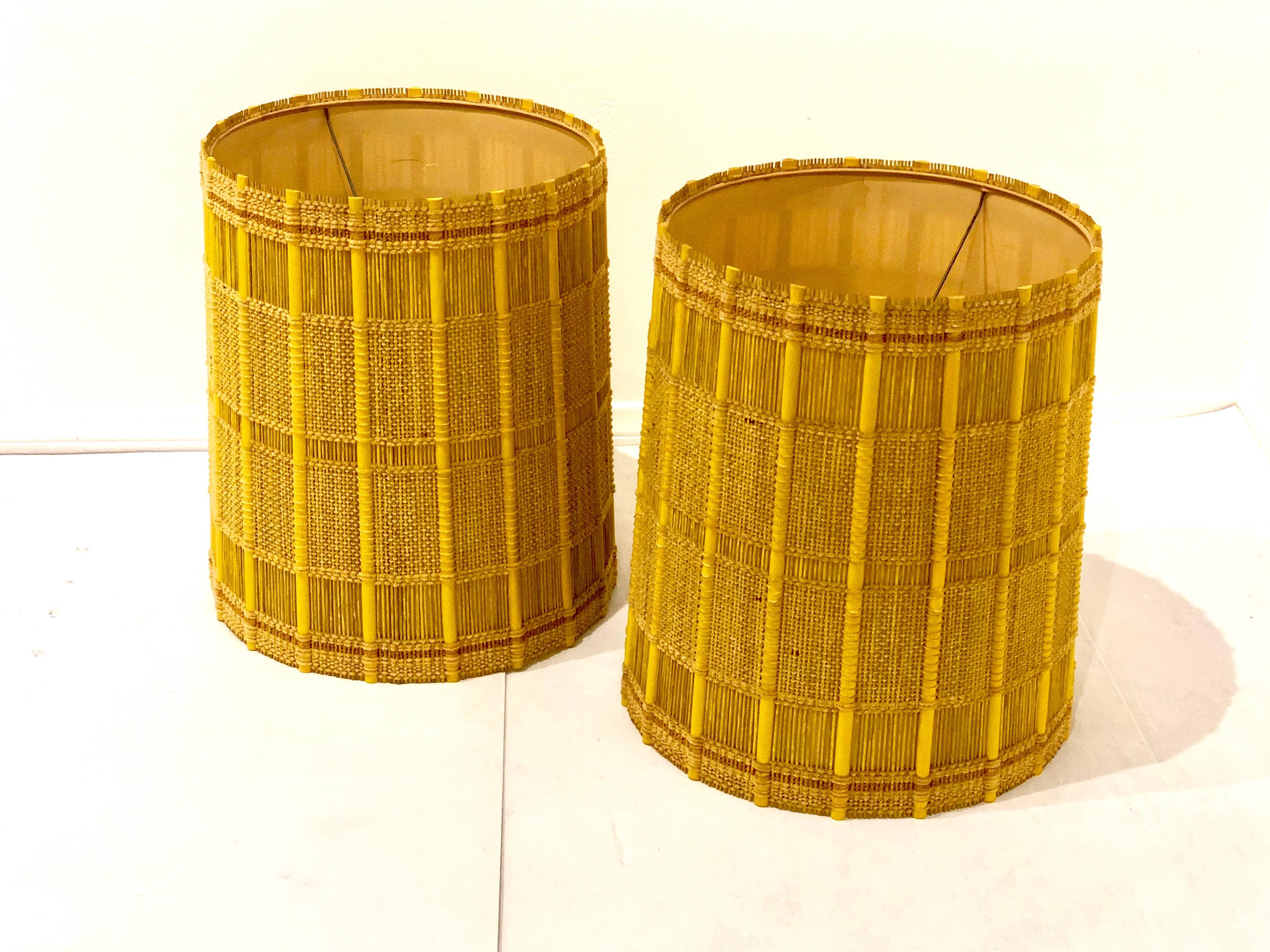 Striking pair of textured lamp shades by Maria Kipp. Wood and fabric. Nice yellow color and very clean condition small inside crack on one shade as shown.