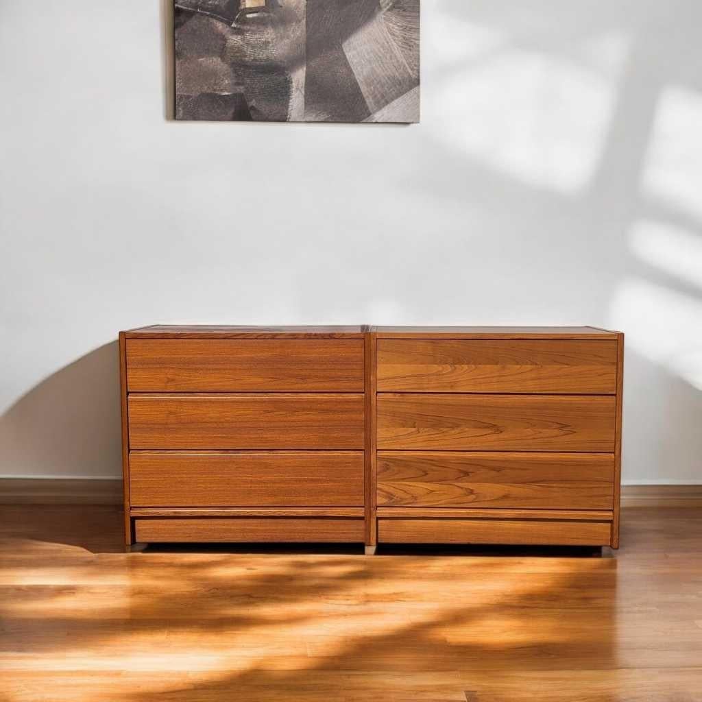 A refined pair of Mid-Century Modern teak dressers from the 1960s, designed in the Scandinavian modern style characterized by clean lines, warm wood tones, and minimalist form.

Each dresser features three wide drawers with recessed pulls and a