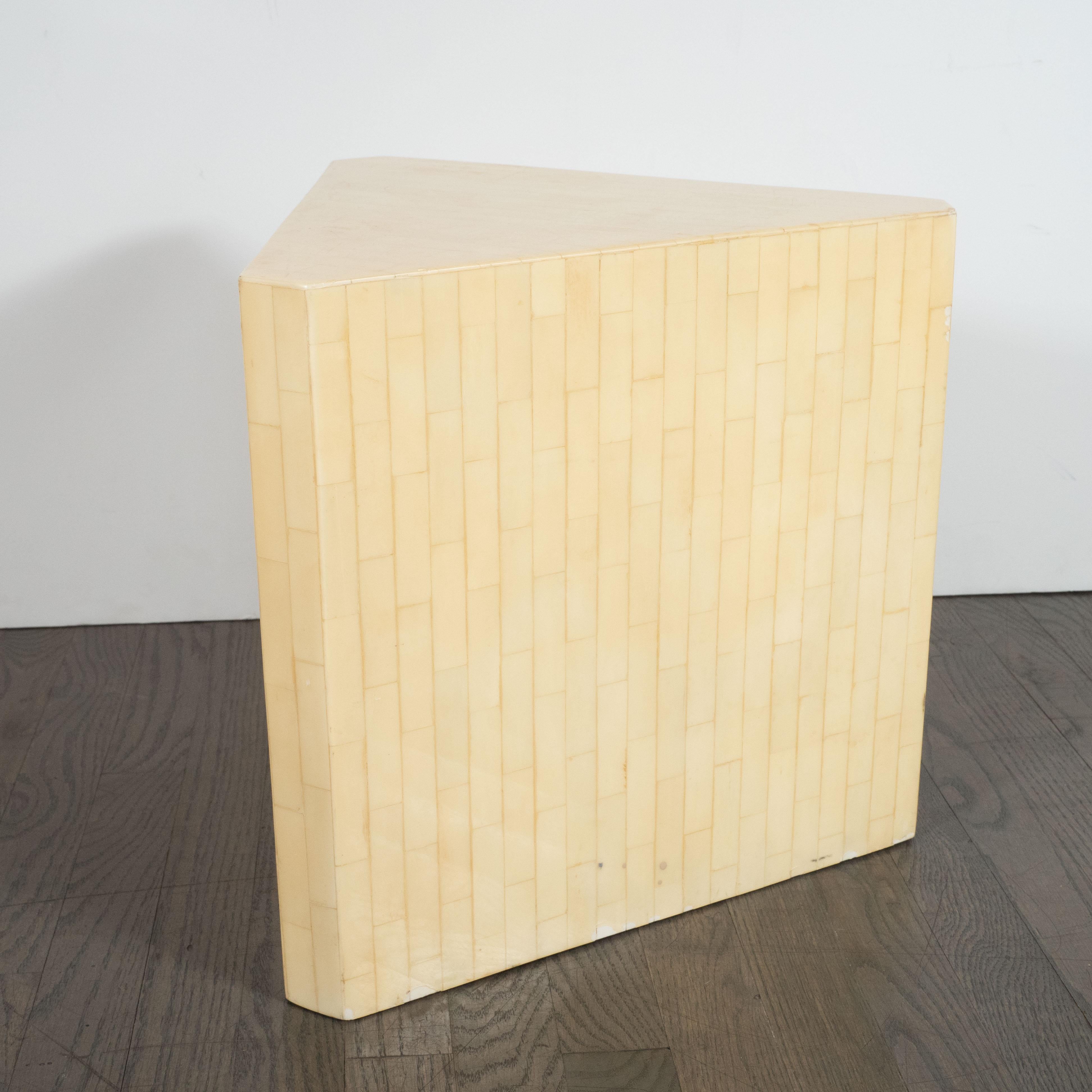 This gorgeous pair of Mid-Century Modern tessellated stone end/side Tables were realized by the esteemed American design firm Maitland Smith, circa 1980. They offer volumetric triangular forms with squared corners composed of an abundance of