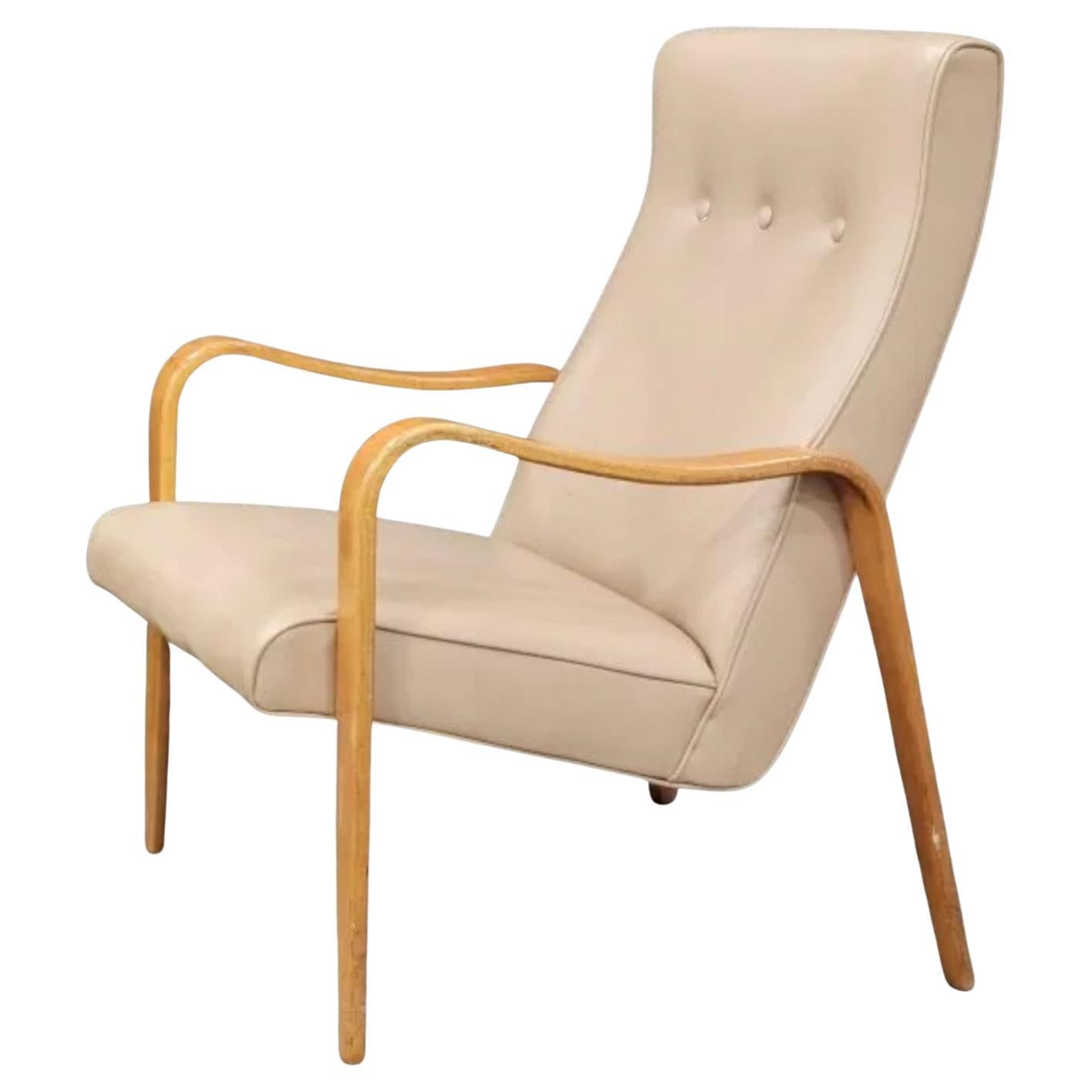 Pair of Mid-Century Modern Thonet bentwood birch lounge arm chairs. Has original medium pastel Tan Sand vinyl upholstery. Great vintage condition. Timeless chair design by Thonet. Curved birch bentwood arms. Chairs sold as a set of (2). Located in