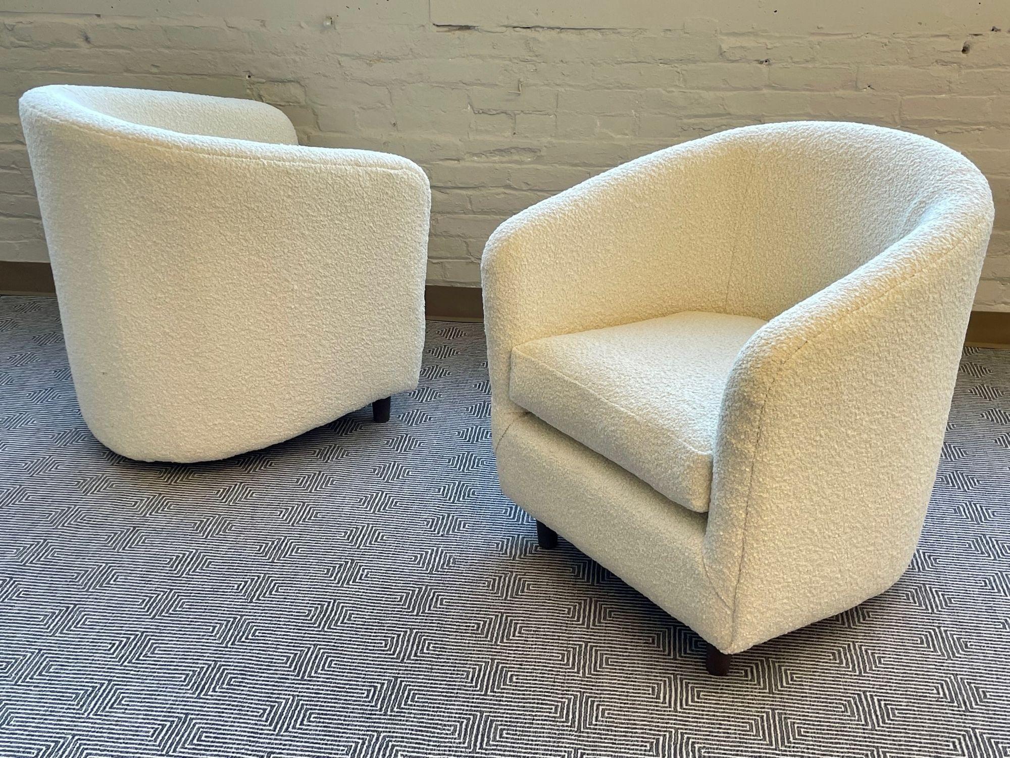 Pair of Mid-Century Modern Tub Chairs, Boucle, American Designer, 2000s
 
Mid-Century lounge chairs by an unkown American designer from the earlier 2000s. Newly upholstered in a thick, nubby, white boucle. 
 
Other American designers of the