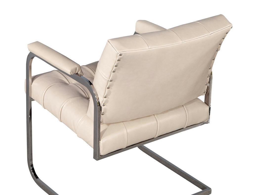 Stainless Steel Pair of Mid-Century Modern Tufted Cream Leather Accent Chairs For Sale