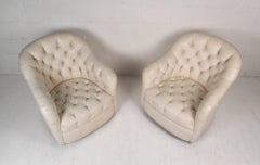 Pair of Mid-Century Modern Tufted Vinyl Lounge Chairs