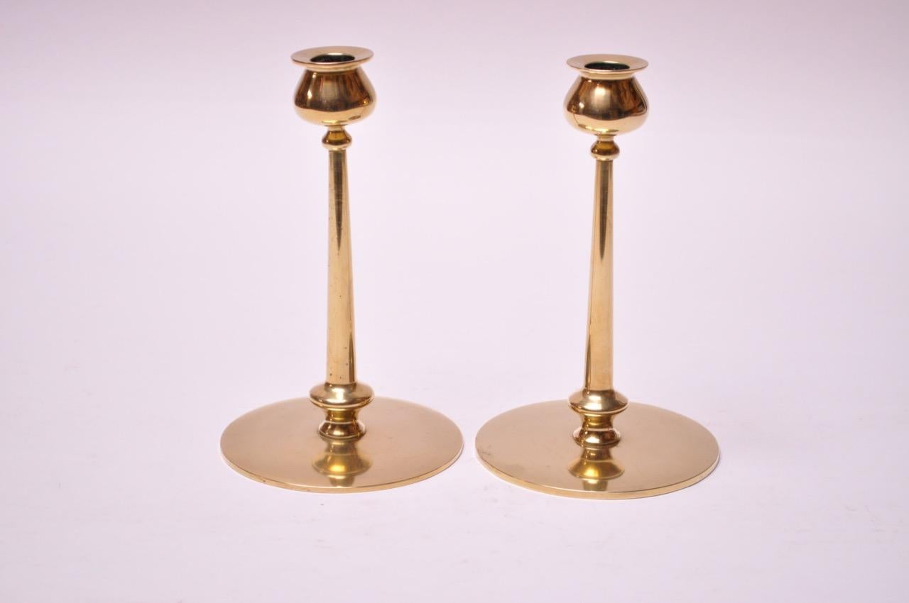Midcentury brass turned candlesticks, each with bulbous bobeche and cylindrical stem on circular base.
Nice, polished condition with only minor wear consistent with age and history.