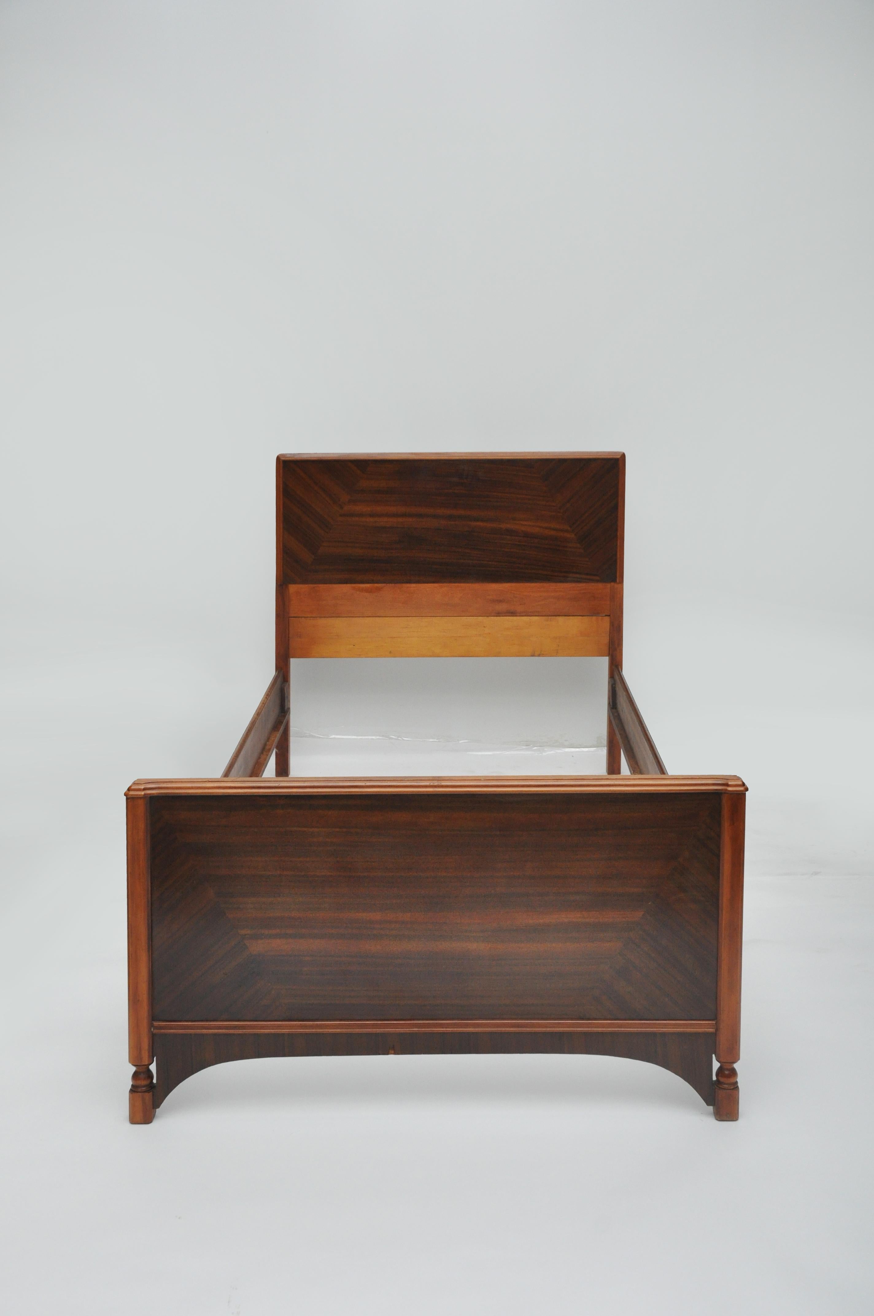 Pair of Mid-Century Modern twin single bed frames. The grain of the wood is fabulous. Length of bed is 87.5