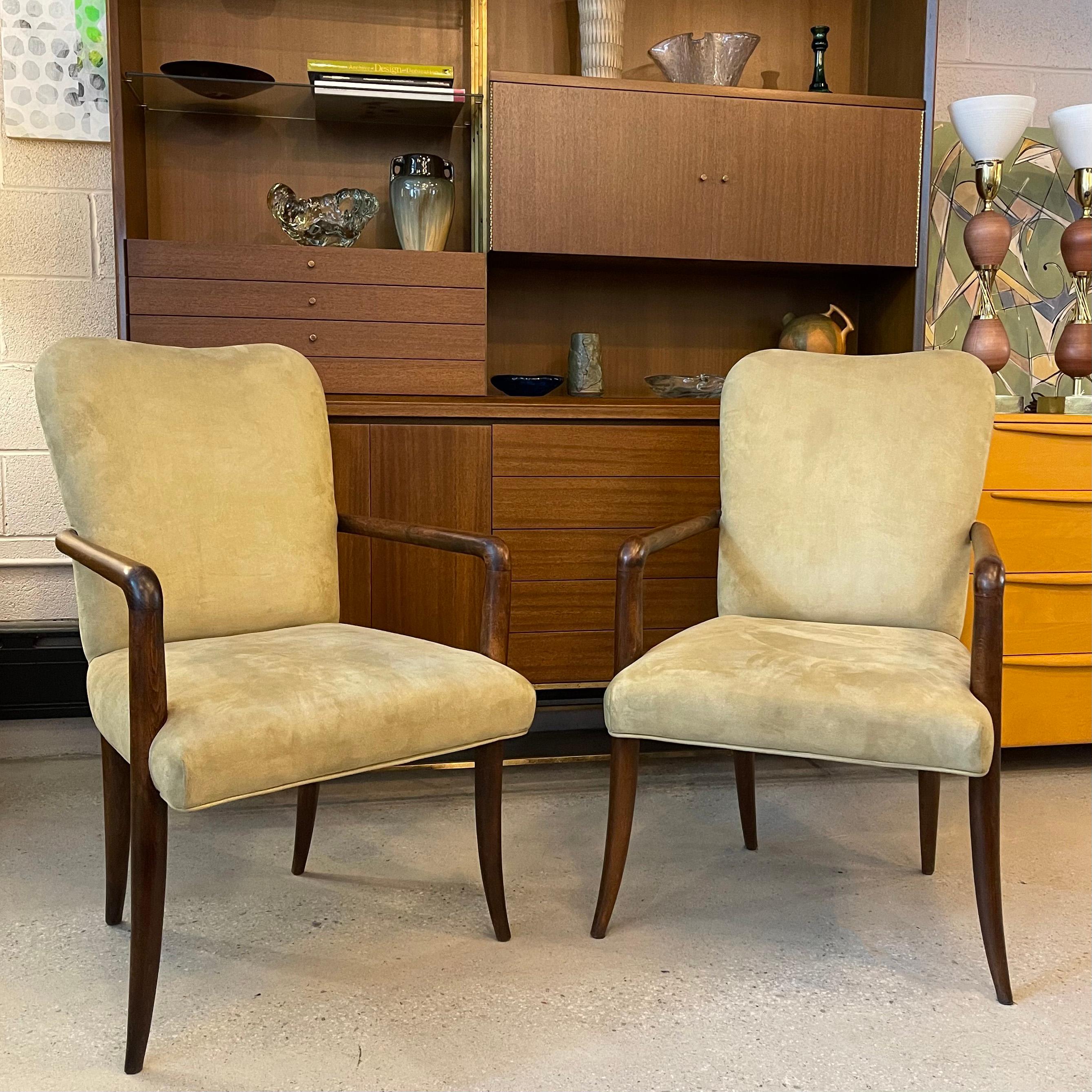 Pair of stately, mid-century modern armchairs feature tannish celadon ultrasuede upholstery with high, sweetheart backs and slender oak arms and sabre legs. A truely elegant seating pair that compliments any setting or decor.  