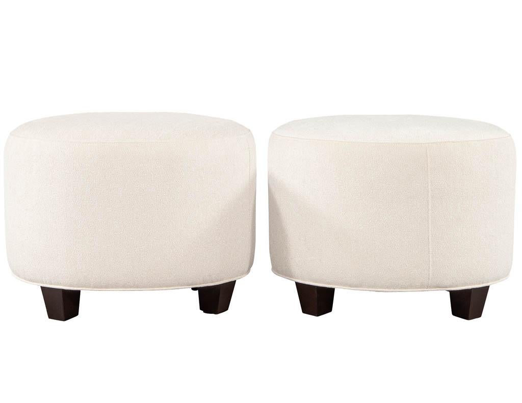 Pair of Mid-Century Modern upholstered ottoman stools. Vintage Mid-Century Modern ottomans stools newly restored in textured cream fabric.

Price includes complimentary curb side delivery to the continental USA.