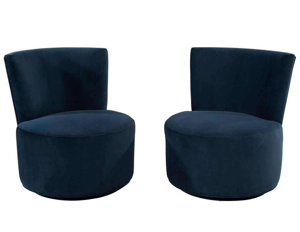 Pair of Mid-Century Modern upholstered Swivel chairs in the style of Dunbar. Newly restored in designer navy velvet.

Price includes complimentary curb side delivery to the continental USA.