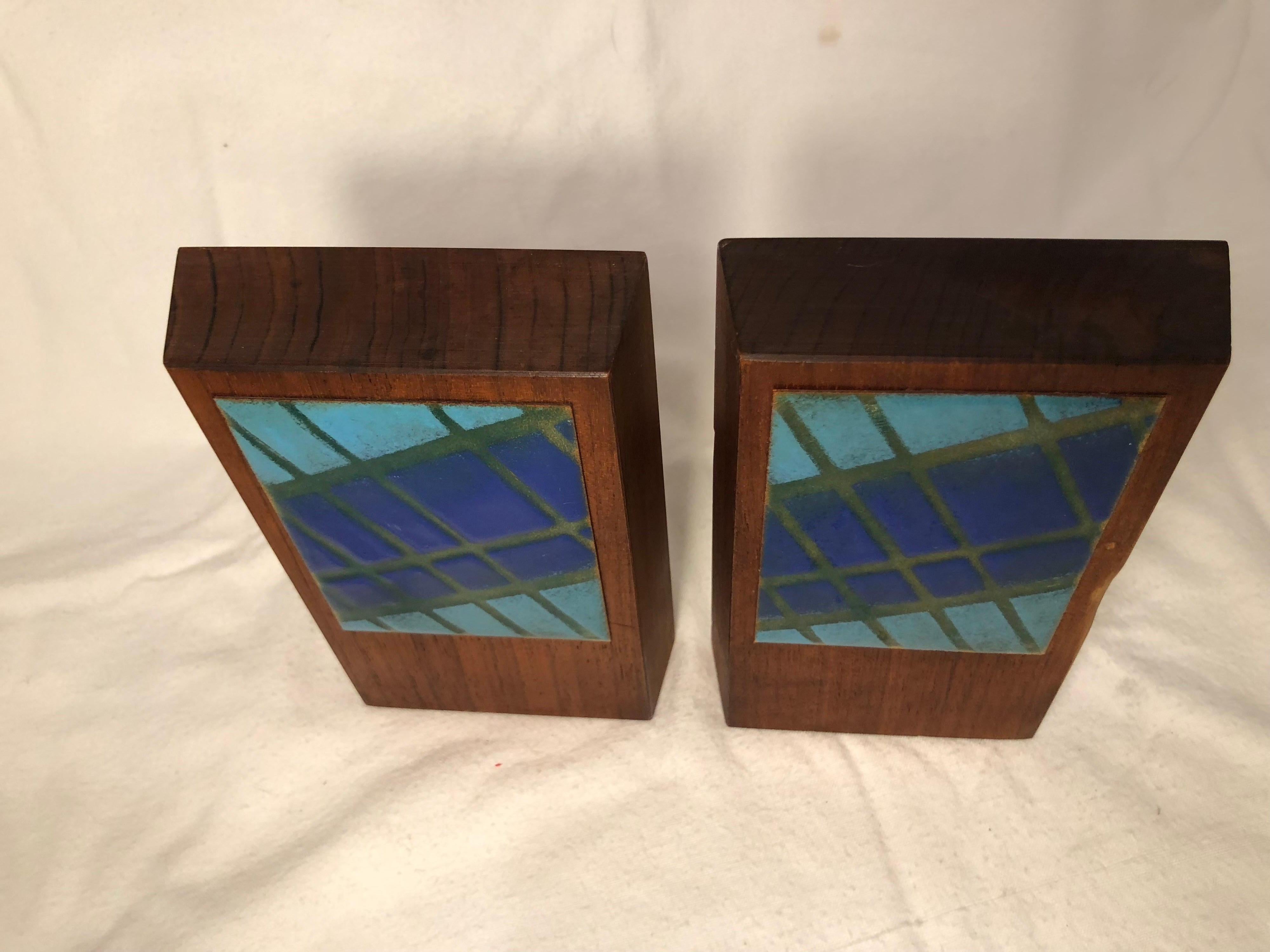 Pair of Mid-Century Modern walnut and enamel bookends. Signed by Ernest John.
The perfect accessory to a mid century office. Colorful and vibrant. These can parcel ship for $29 domestically
