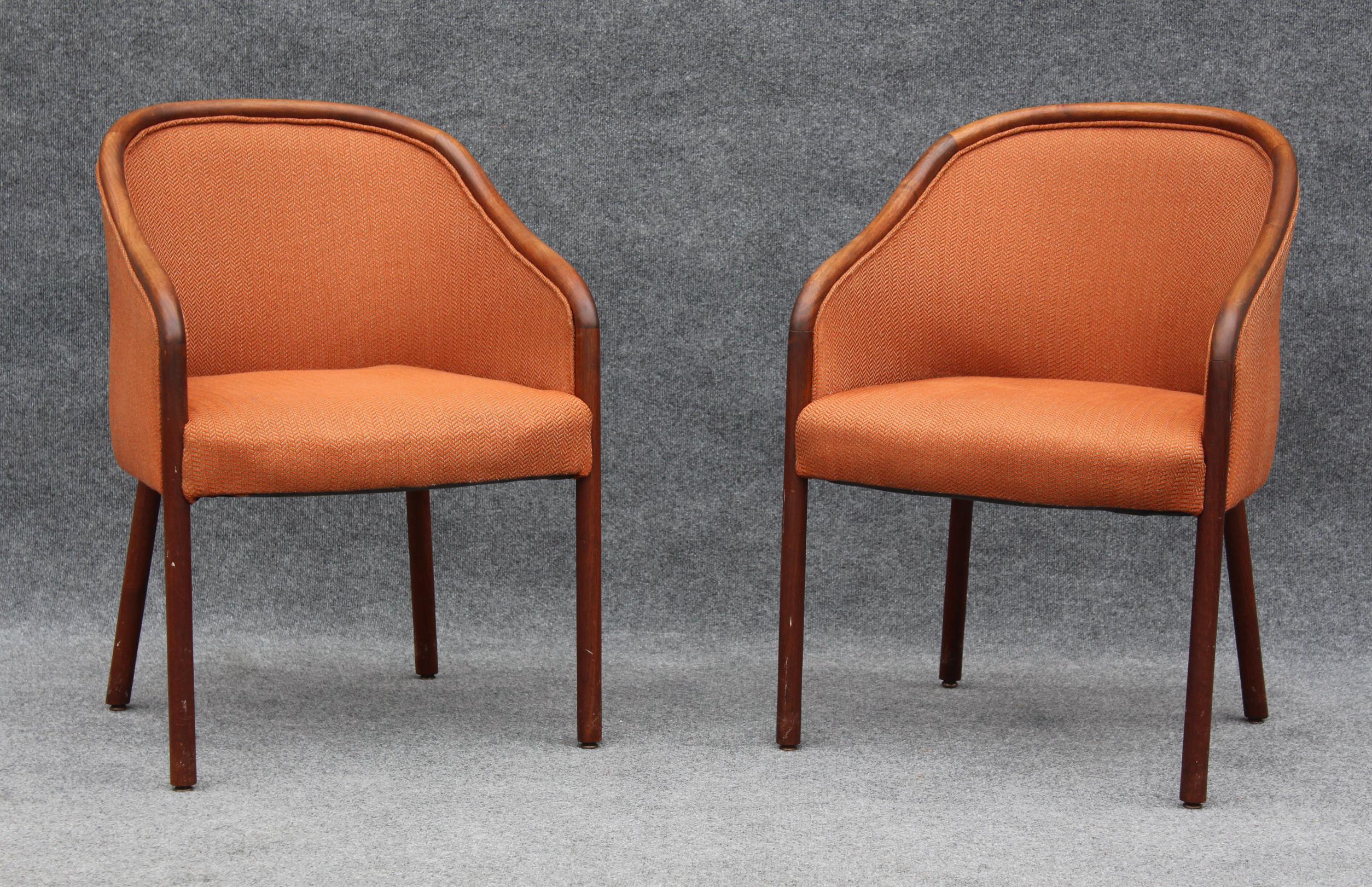 This pair of armchairs or side chairs was made after the iconic Ward Bennett design in the 1970s. Featuring clean lines and solid walnut frame construction, their upholstry is in great shape. Pictured with our Ward Bennett style I-beam side tables,