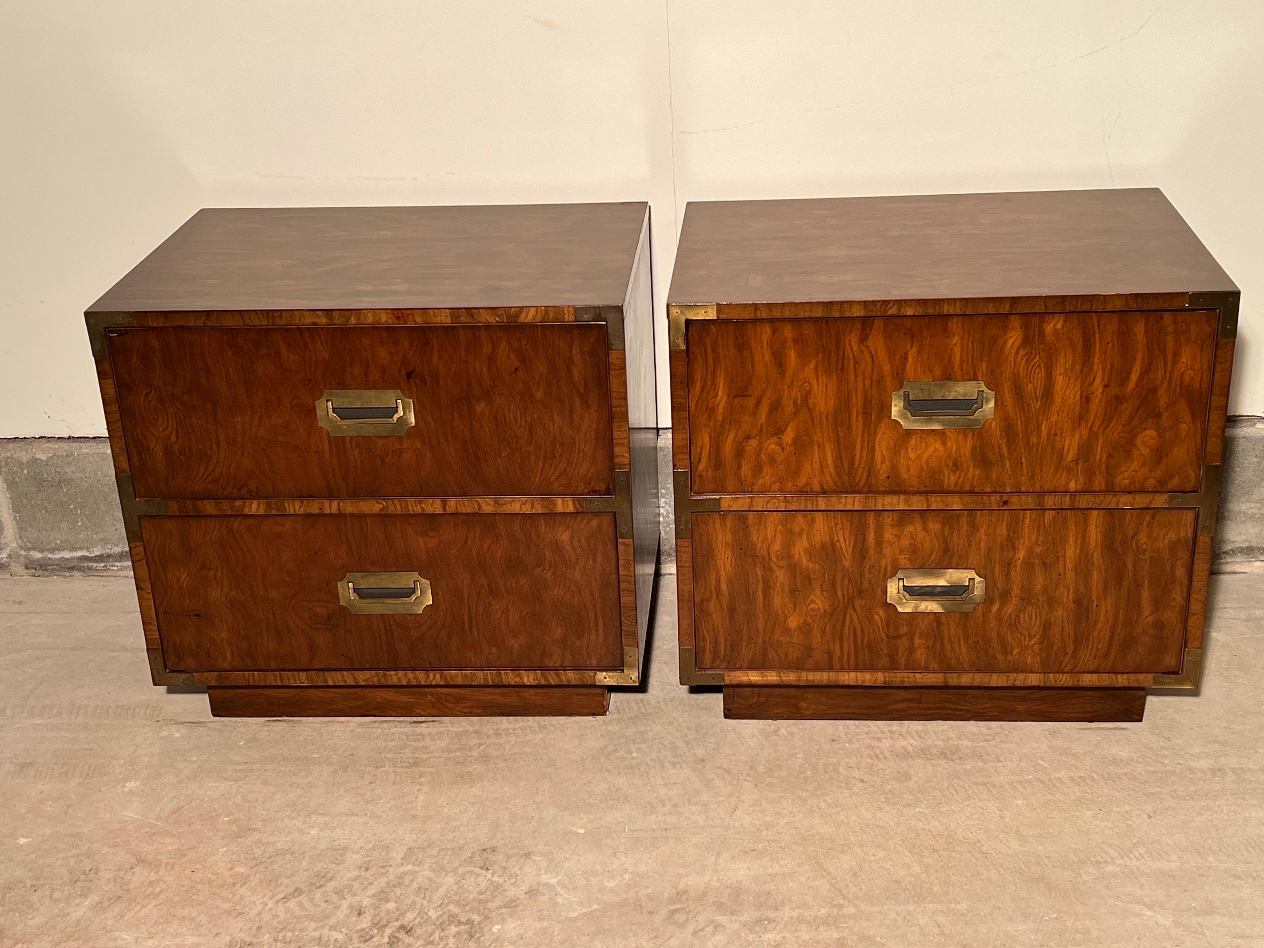 Pair of Mid-Century Modern walnut campaign dressers. Classic and timeless design to these beauties.
Rich walnut wood with chunky brass plated hardware and a recessed plinth platform.
 