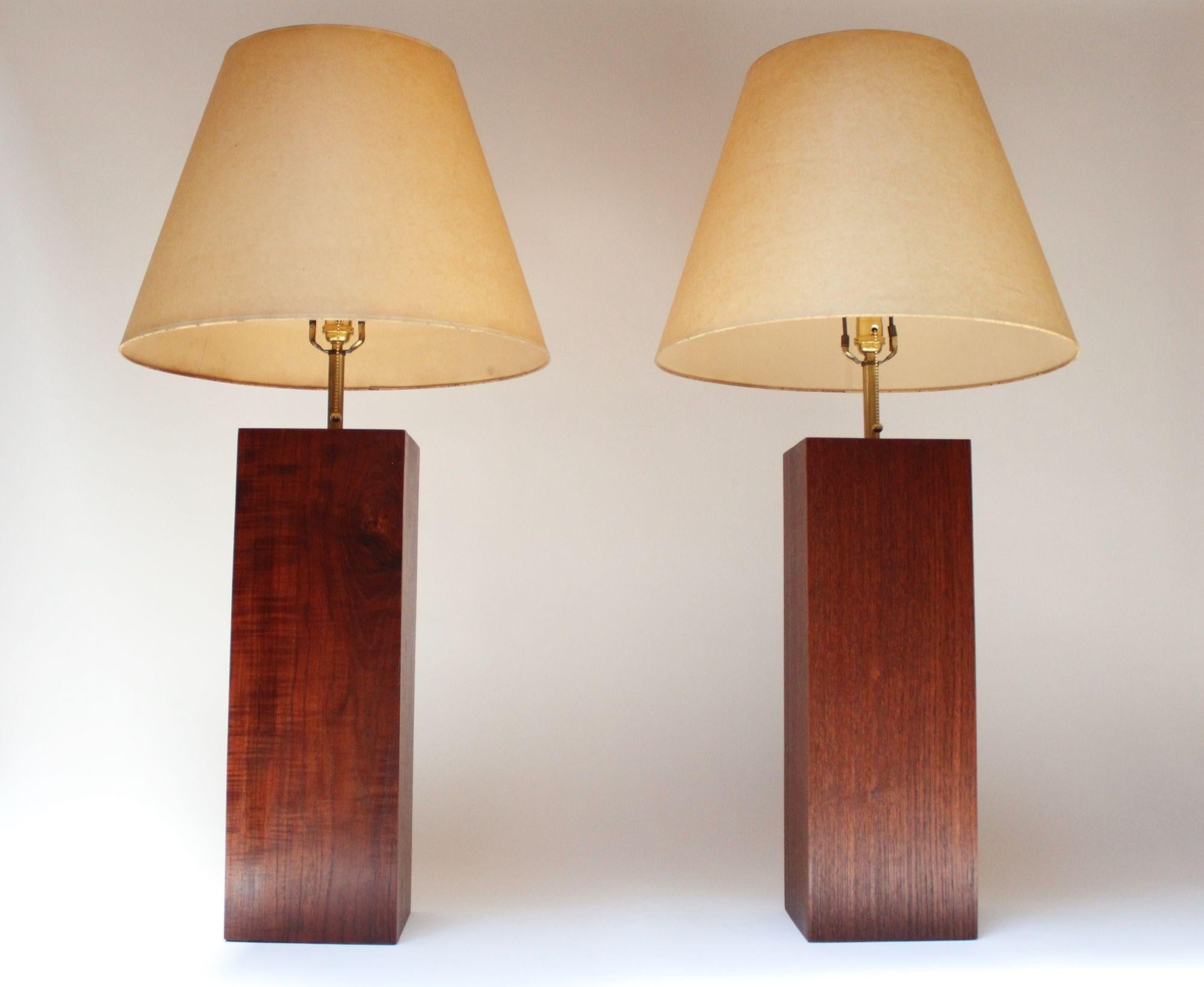 Handsome pair of vintage column/block-form table lamps in walnut with brass stems (ca. 1960s, USA). Organic form with clean lines and exquisite wood grain. (Shades are for demonstration purposes only and are not included.)
Large in scale measuring
