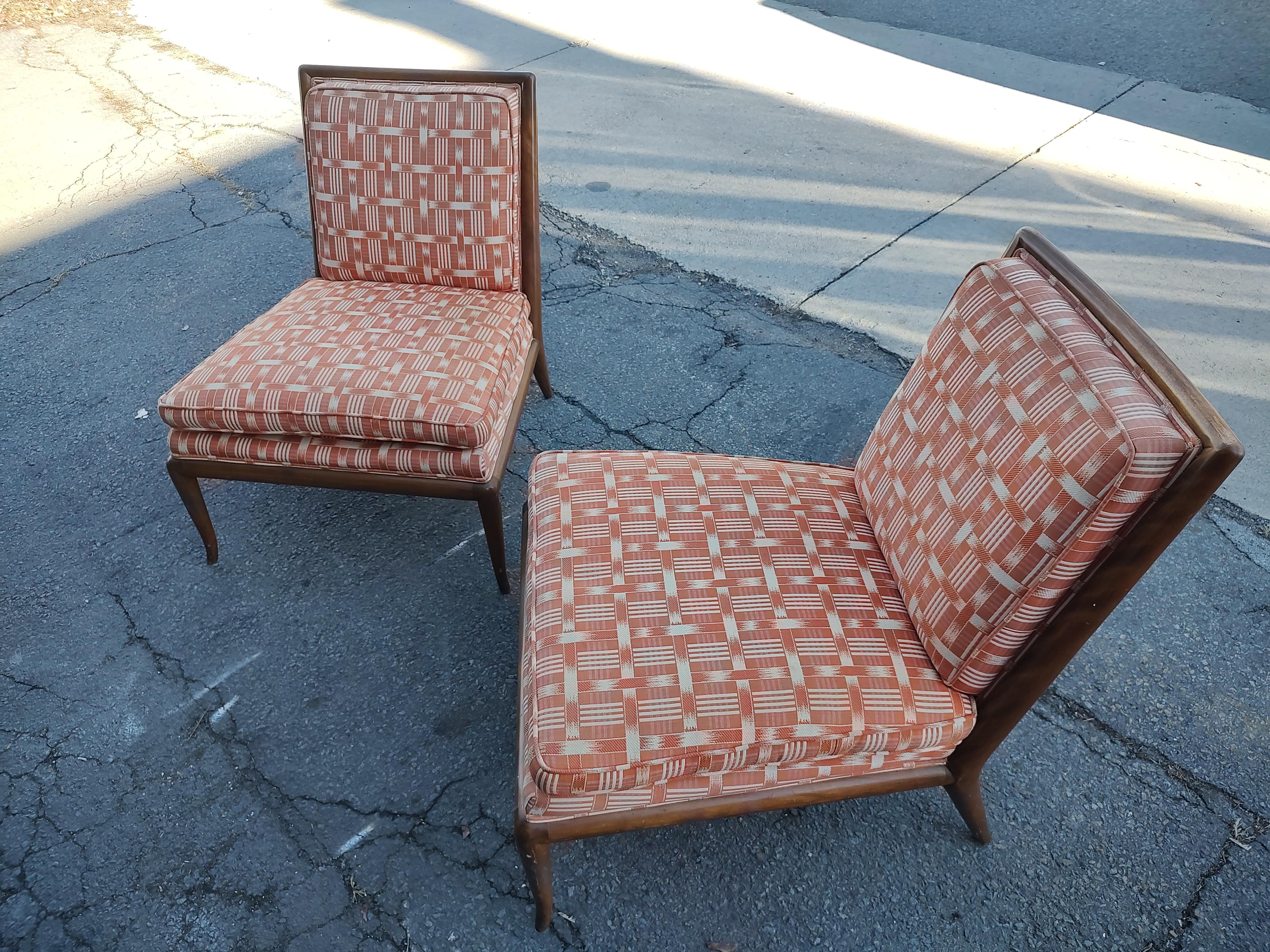 Fabulous roomy pair of Sculptural walnut lounge chairs by Robs Johns Gibbons from the early 60s. The frames are in excellent vintage condition with minimal wear, some scuffs but no damage and are tight. The fabric is faded and the seat foam has