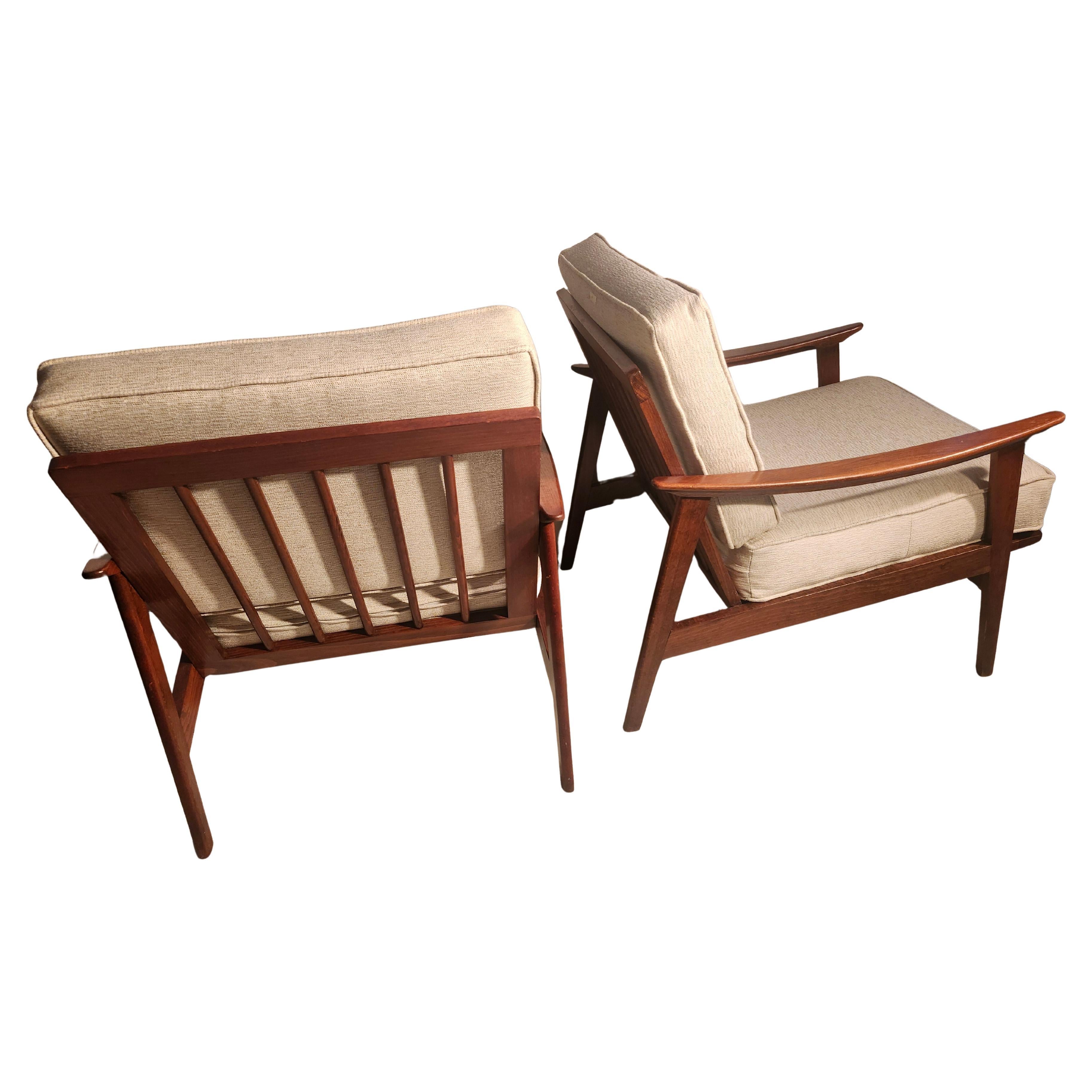 Hand-Crafted Pair of Mid Century Modern Walnut Lounge Chairs with New Cushions For Sale