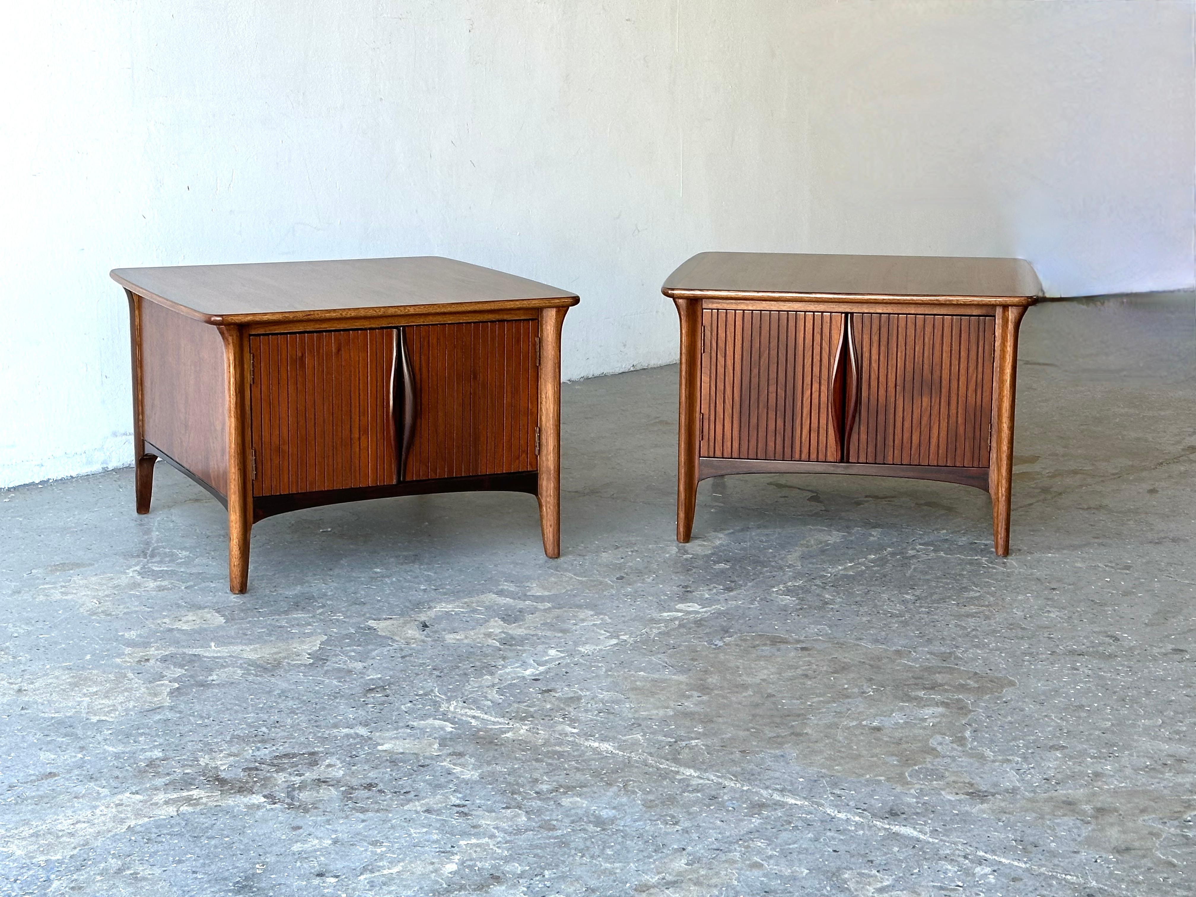 Very cool midcentury Walnut and Rosewood Side / End tables cabinets, Tables have a beautiful wood grain. Door opens in the front for lots of storage Beautifully refinished and restored 

28 inches, wide, 28 inches deep 19 inches high 
Opening is