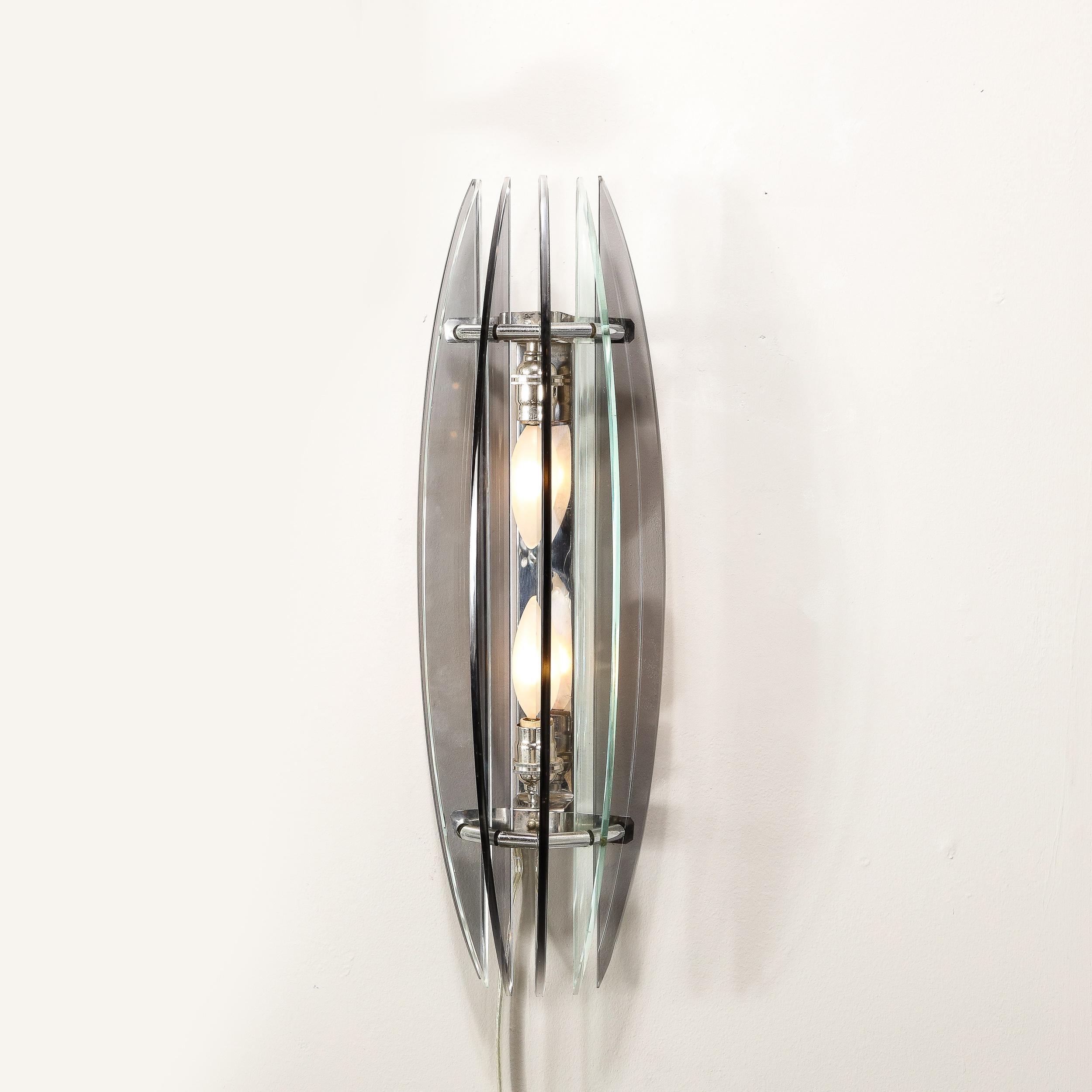 This pair of Mid-Century Modernist Smoked Glass Sconces are fabricated by VECA, originating from Italy, Circa 1970. Composed in five demilune curved smoked glass elements unified by a curved cylindrical frame, their verticality and sleek curvature