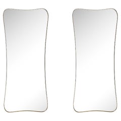 Pair of Mid-Century Modernist Curvilinear Hourglass Form Brass Wrapped Mirrors