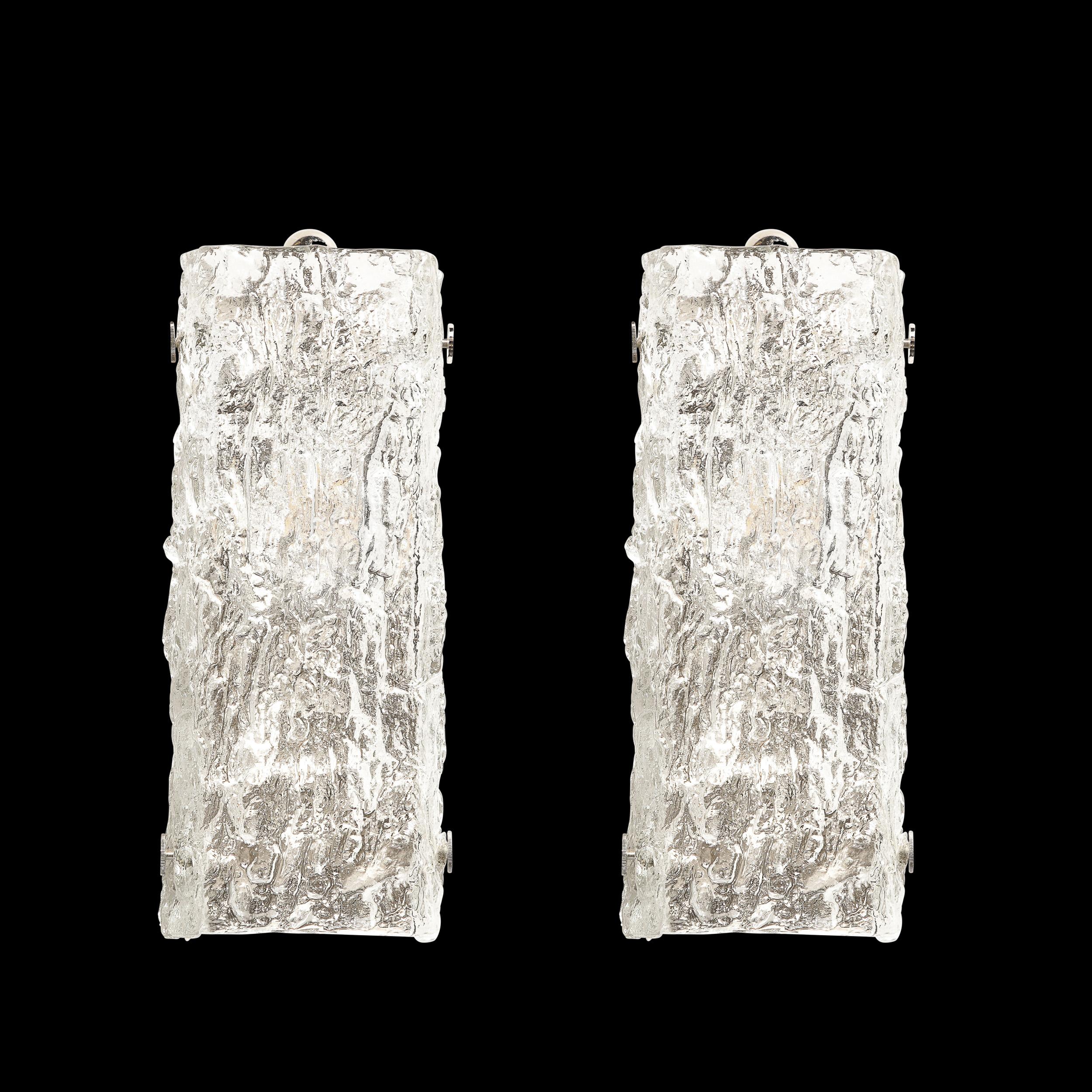 This elegantly subtle pair of Mid-Century Modernist Ice Glass Sconces are by J.T. Kalmar and originate from Austria, Circa 1960. They feature a minimal rectangular profile with a translucent glass shade diffusing light and illuminating the