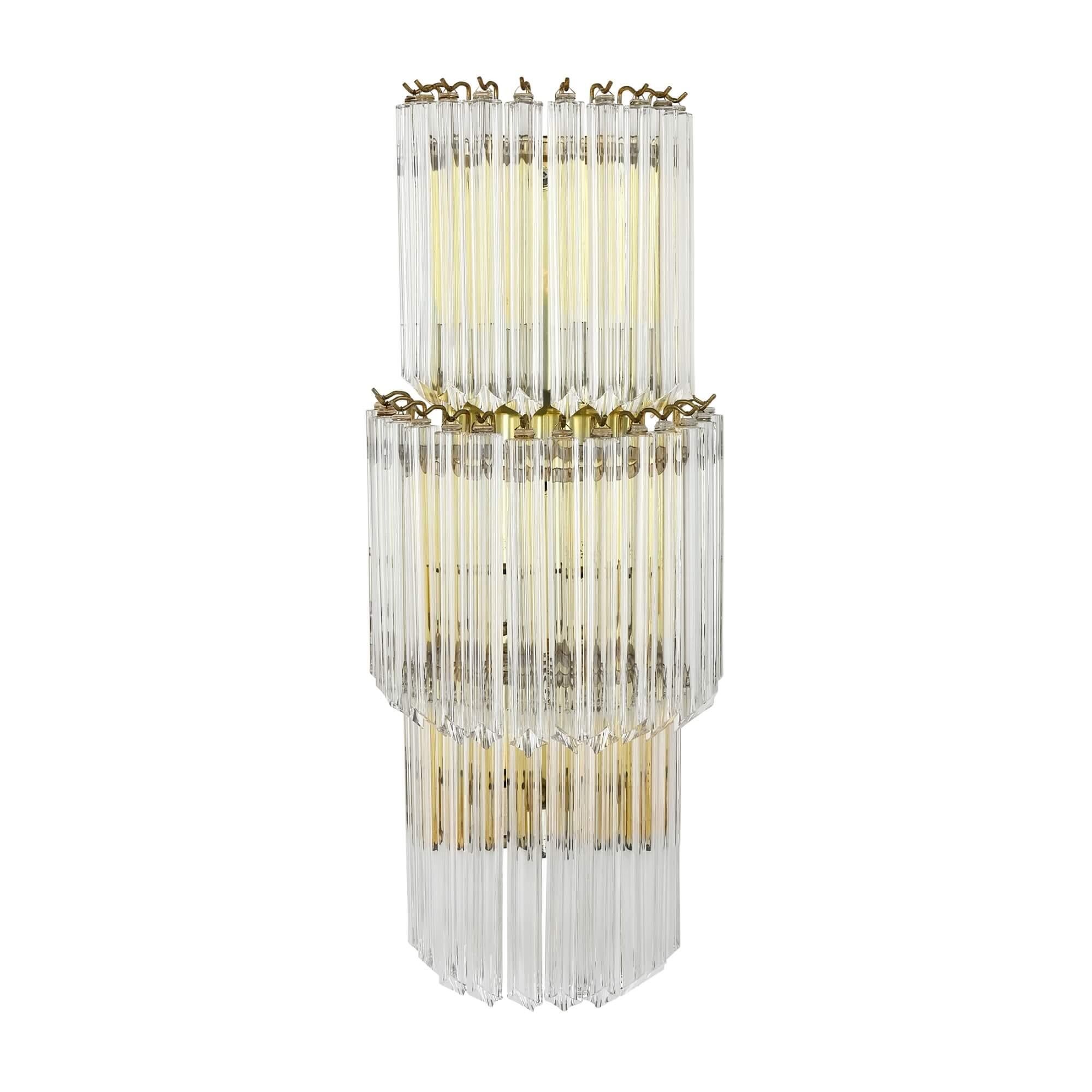 Pair of midcentury Murano glass wall lights by Camer
Italian, Mid-20th century 
Height 82cm, width 33cm, depth 19cm

Made out of Murano glass and brass, this pair of wall lights is a demonstration of high-quality Italian design. 

Individual