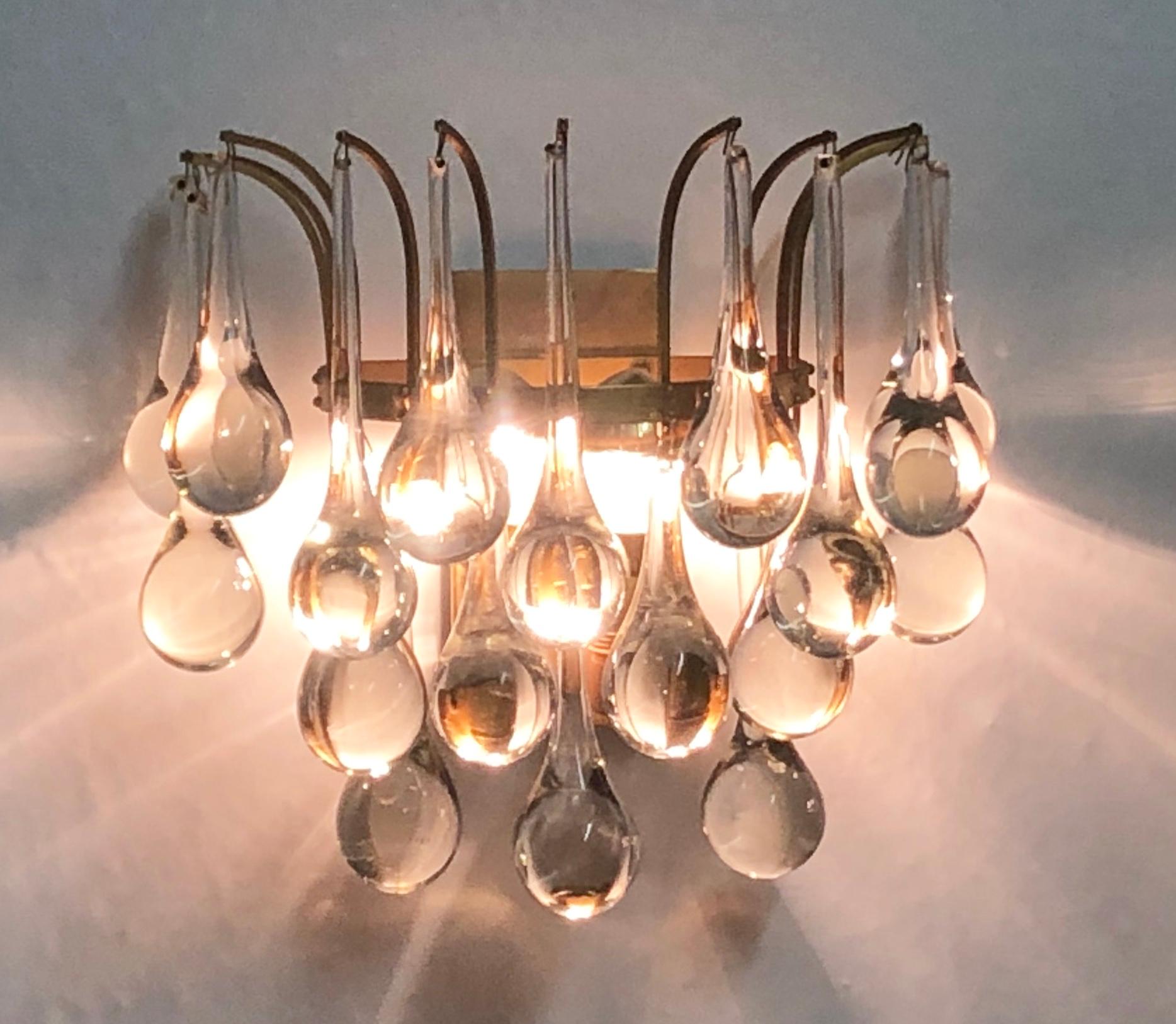 Precious, elegant pair of midcentury brass and Murano crystal drops wall lights by E.Palme, Germany, circa 1960s.
The wall lights are made of gilt brass and clear Murano glass drops.
Socket: each two x E14 - for standard screw bulbs.
Excellent