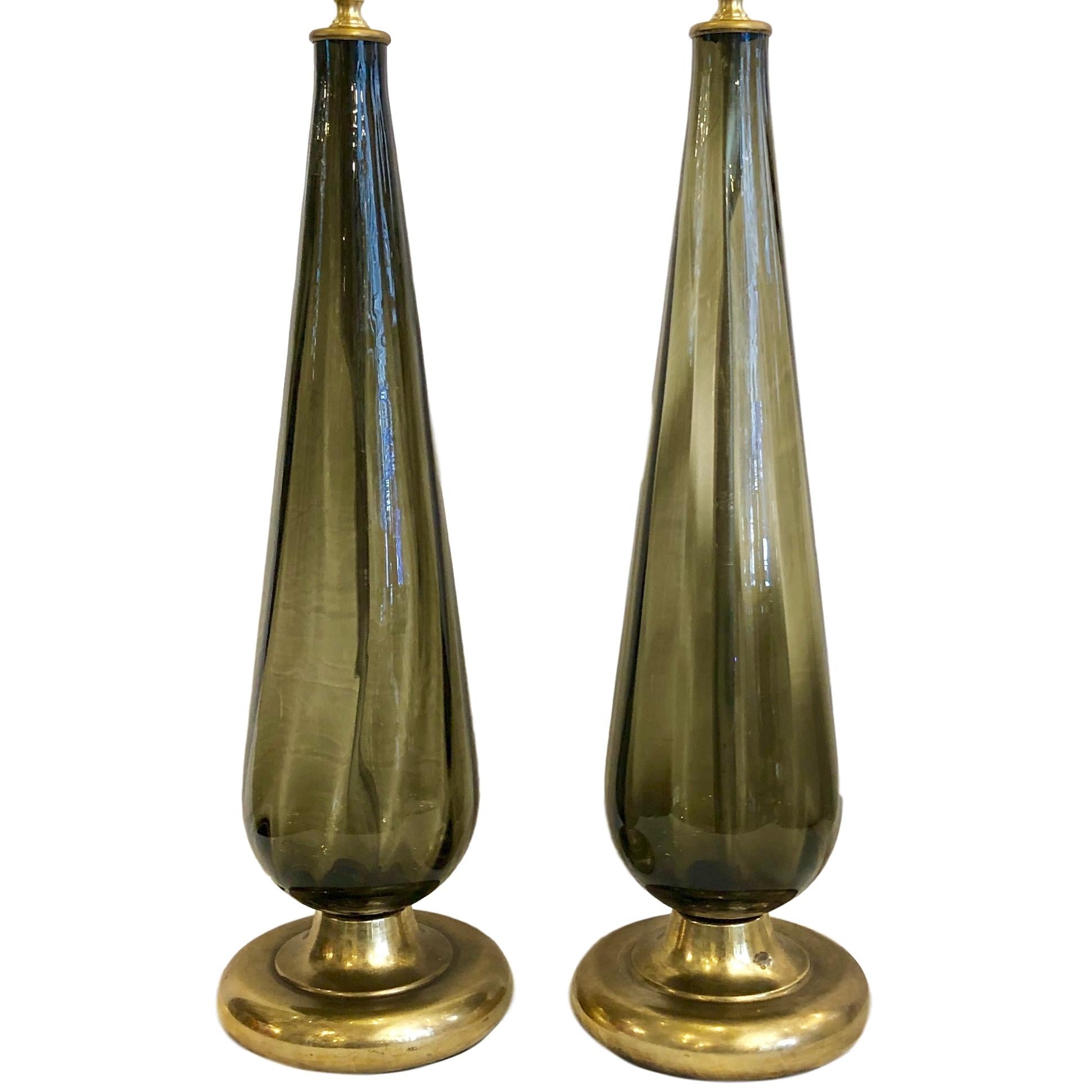 Pair of circa 1960s Italian blown smoke gray glass lamps with a ribbed pattern.

Measurements:
Height of body: 21